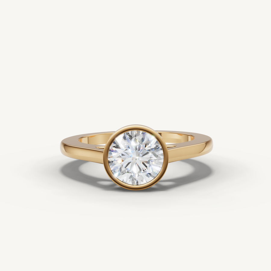 Round lab-grown diamond bezel engagement ring in 14K yellow gold