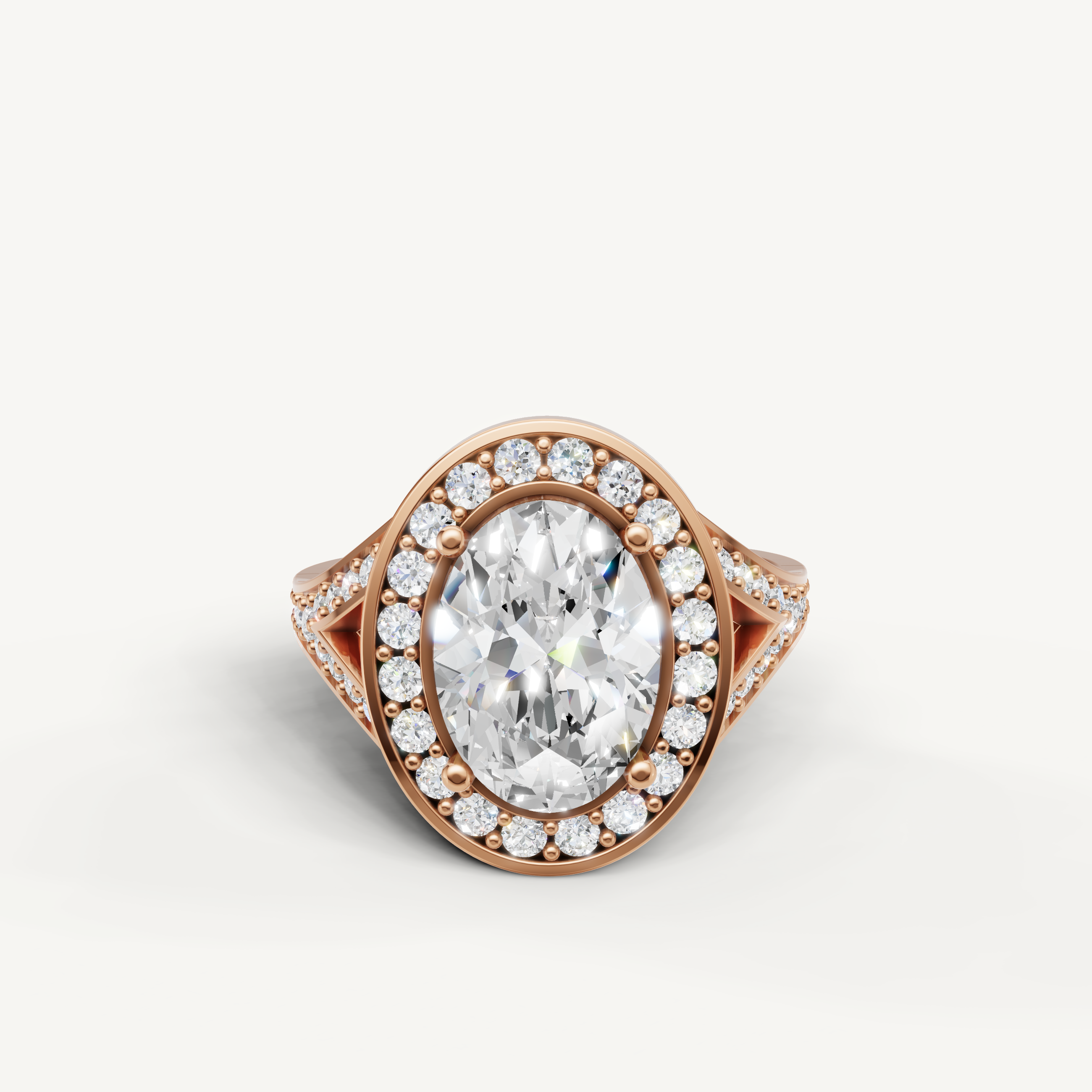 Raul Diamonds oval halo engagement ring in rose gold with pavé diamonds.