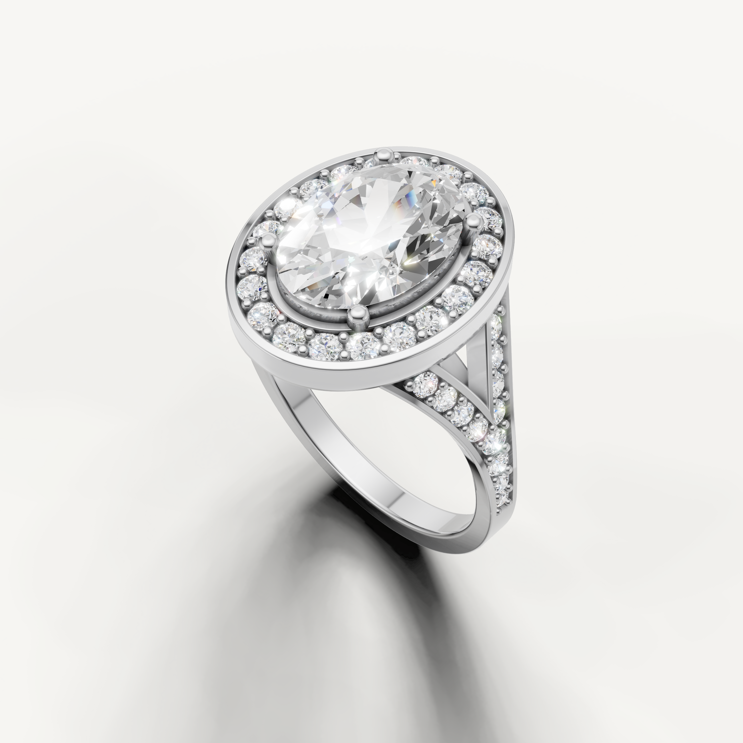 Raul Diamonds elegant oval diamond ring in white gold with pavé split shank.