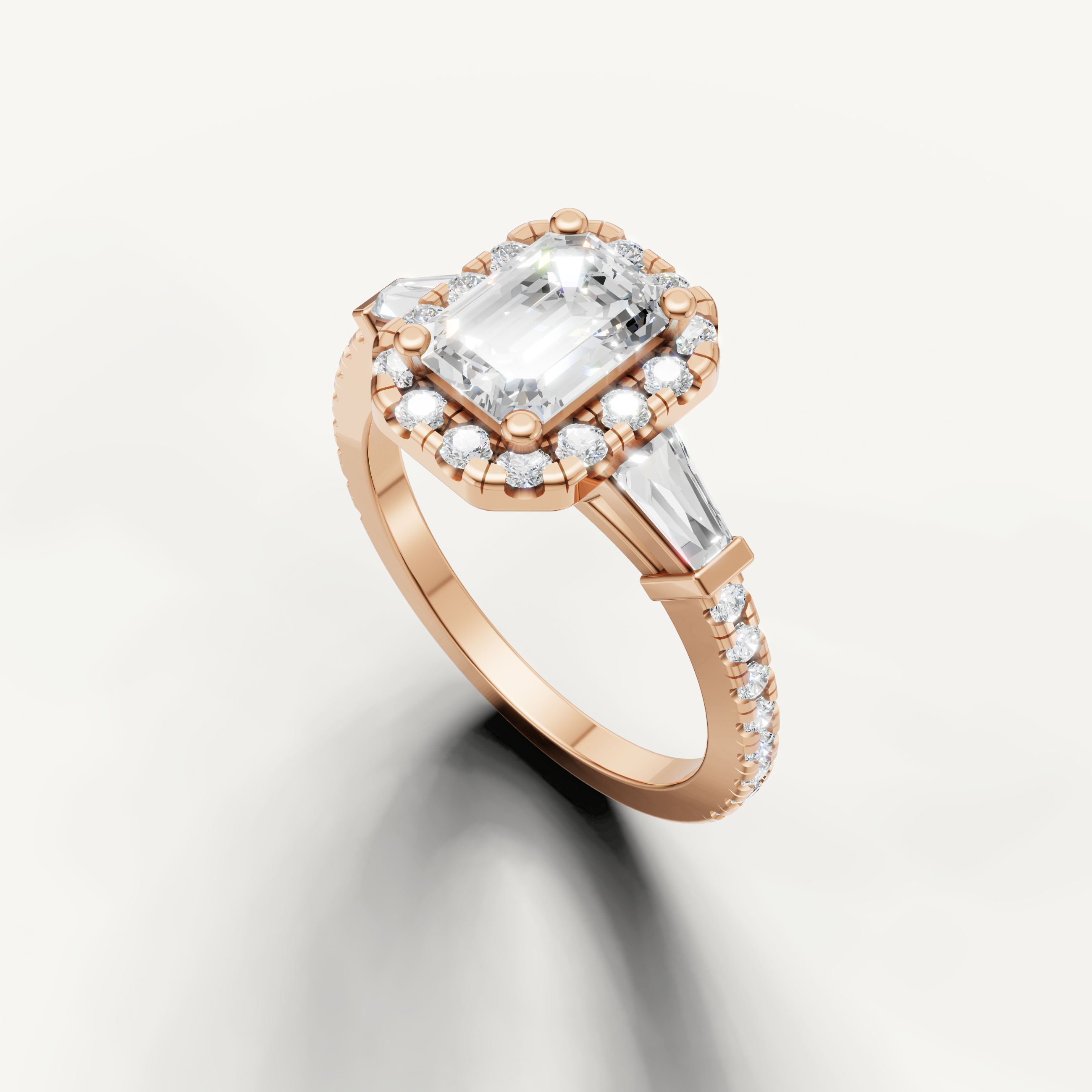 Emerald Cut Diamond Ring with Tapered Side Stones in Yellow Gold