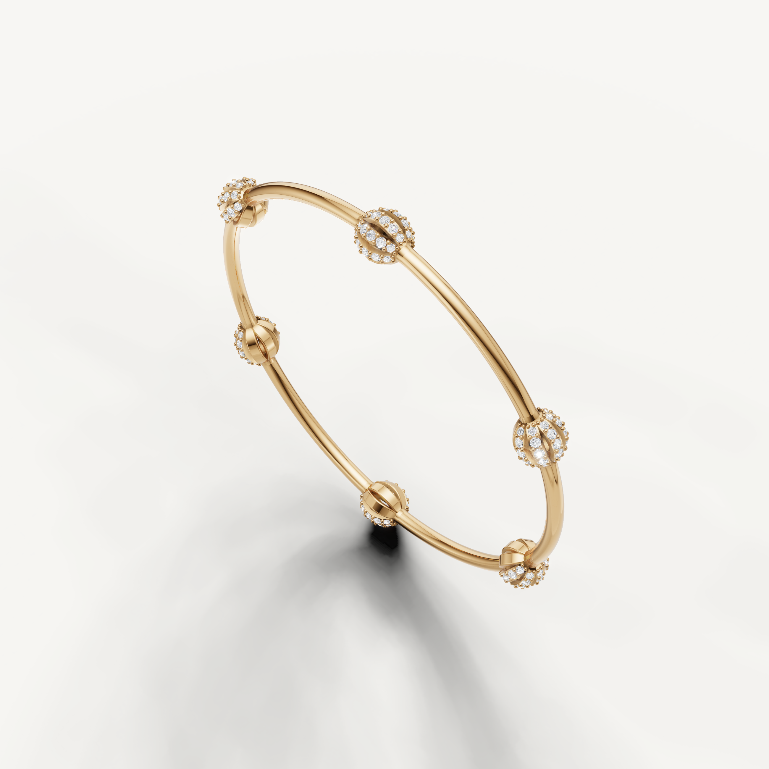 Fine yellow gold diamond bangle for women by Raul Diamonds with sparkling clusters