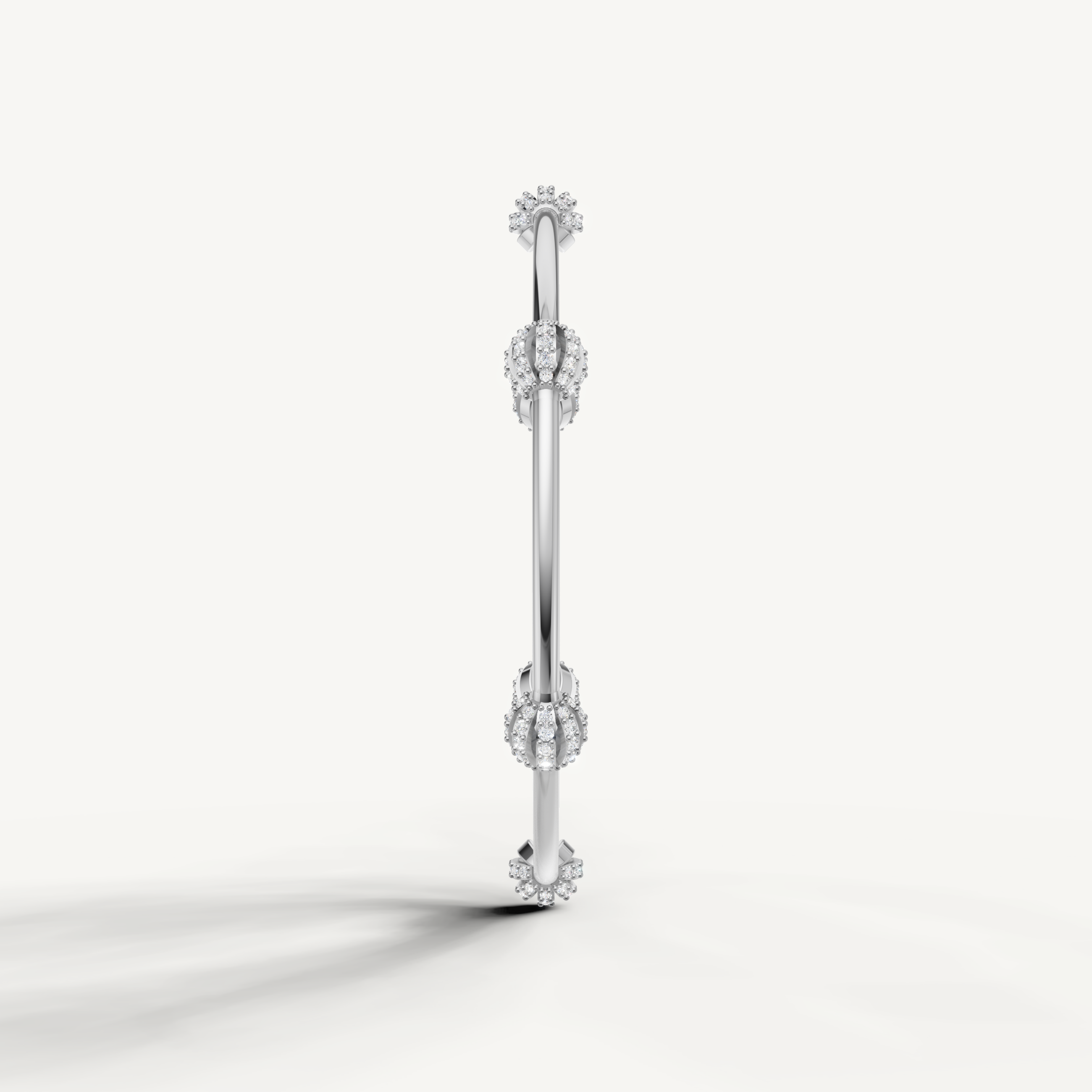 Elegant white gold open bracelet featuring round diamond cluster accents
