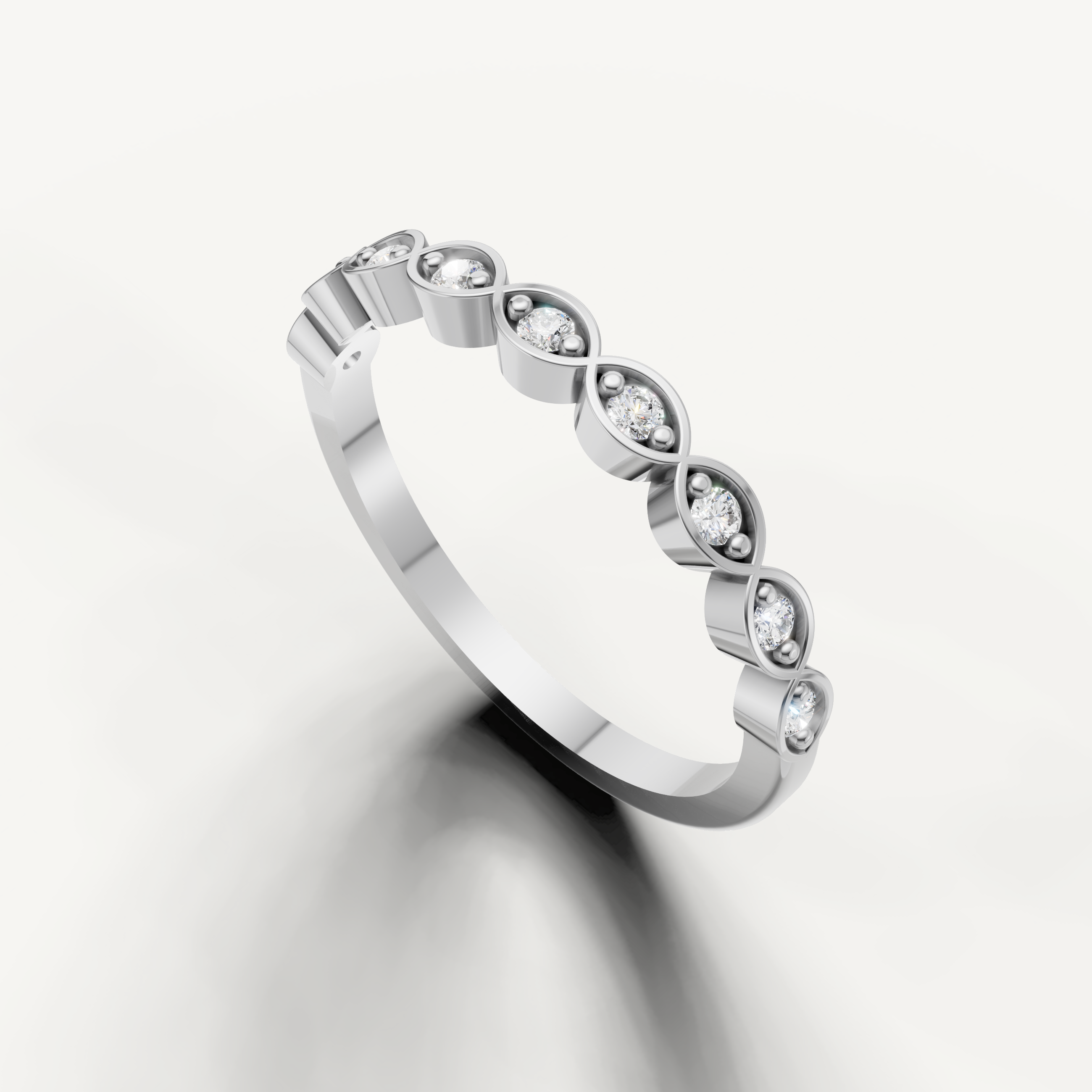 Elegant white gold stackable wedding band featuring round cut diamonds by Raul Diamonds