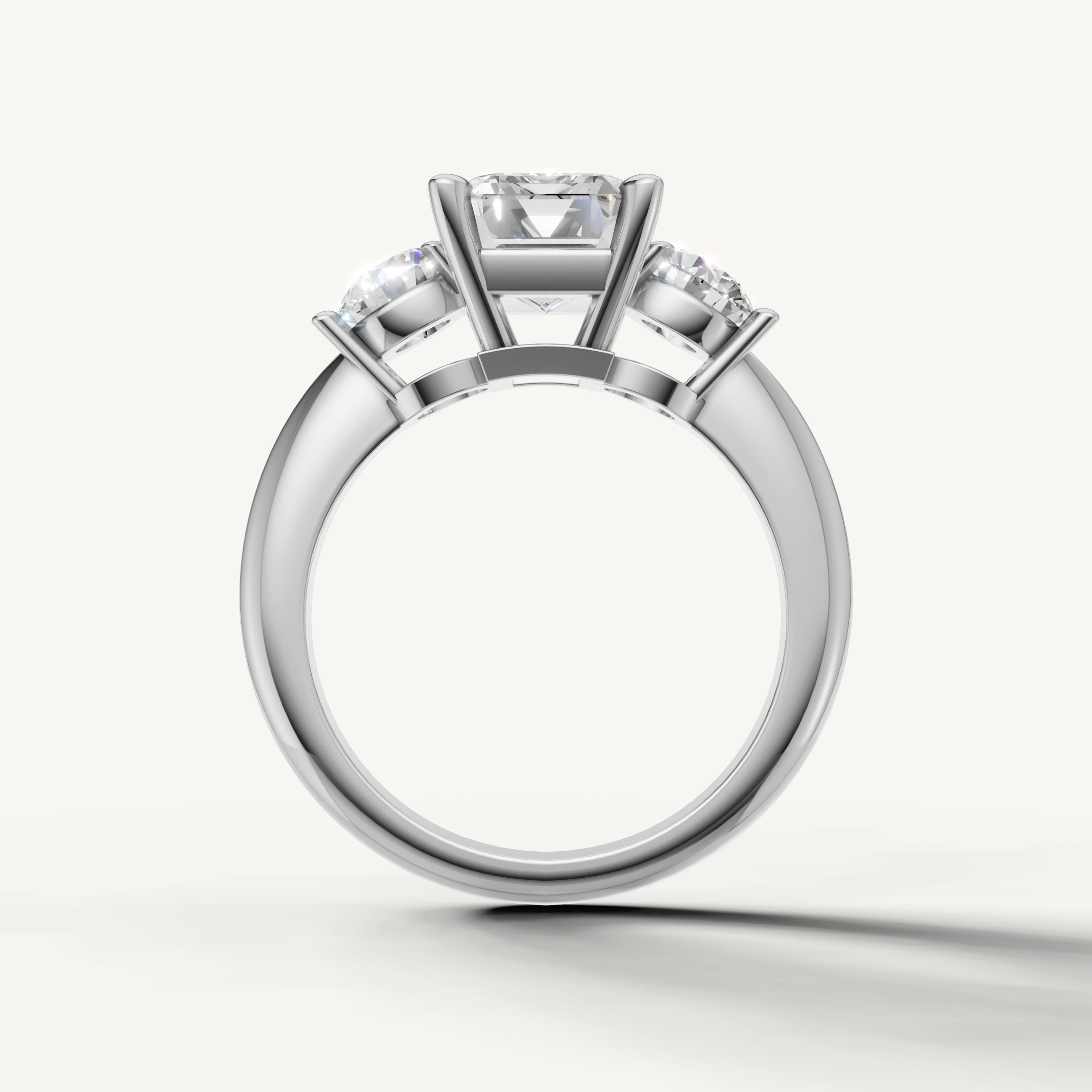 Classic emerald diamond engagement ring with round side stones white gold