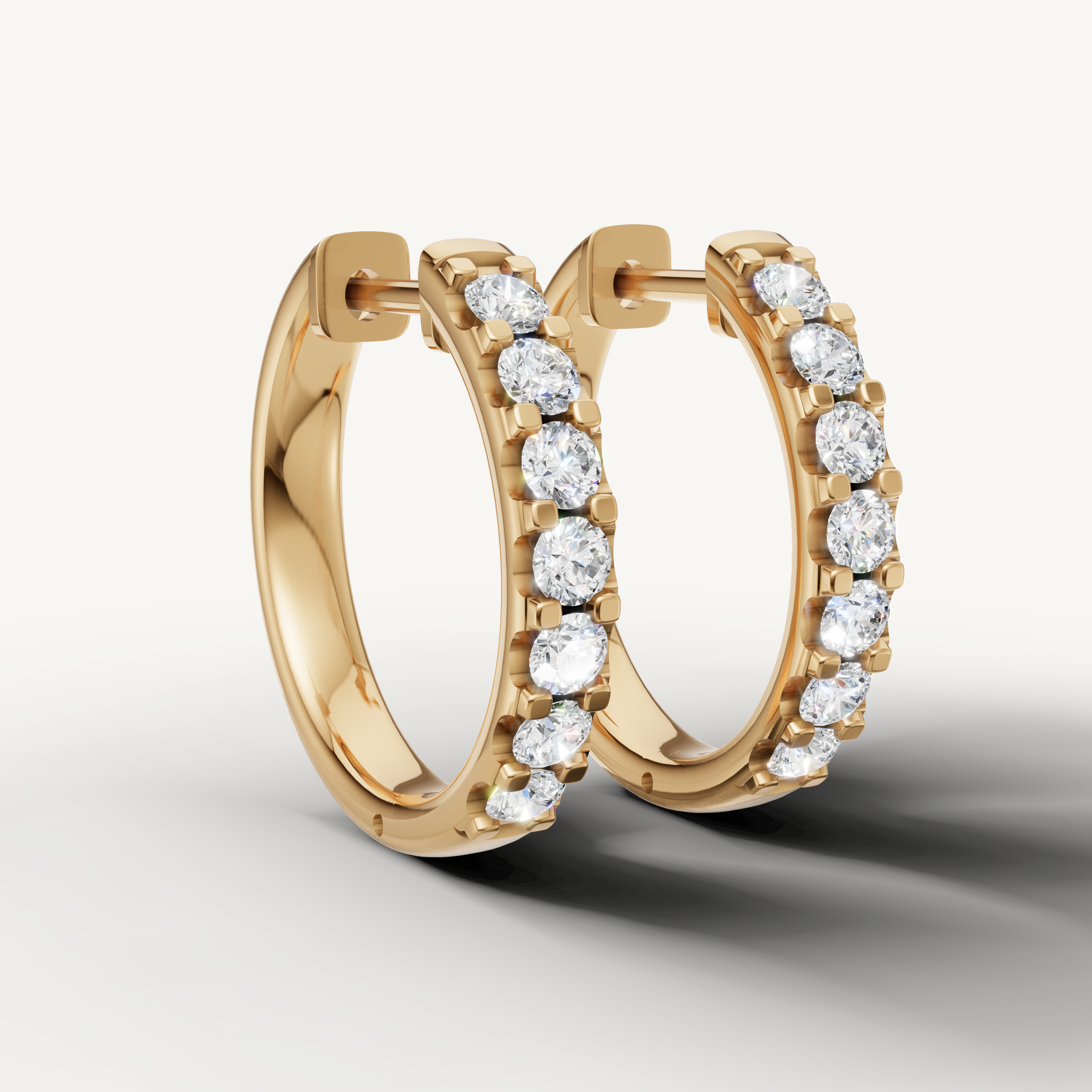 Luxury yellow gold diamond huggie hoop earrings for women with elegant brilliance by Raul Diamonds