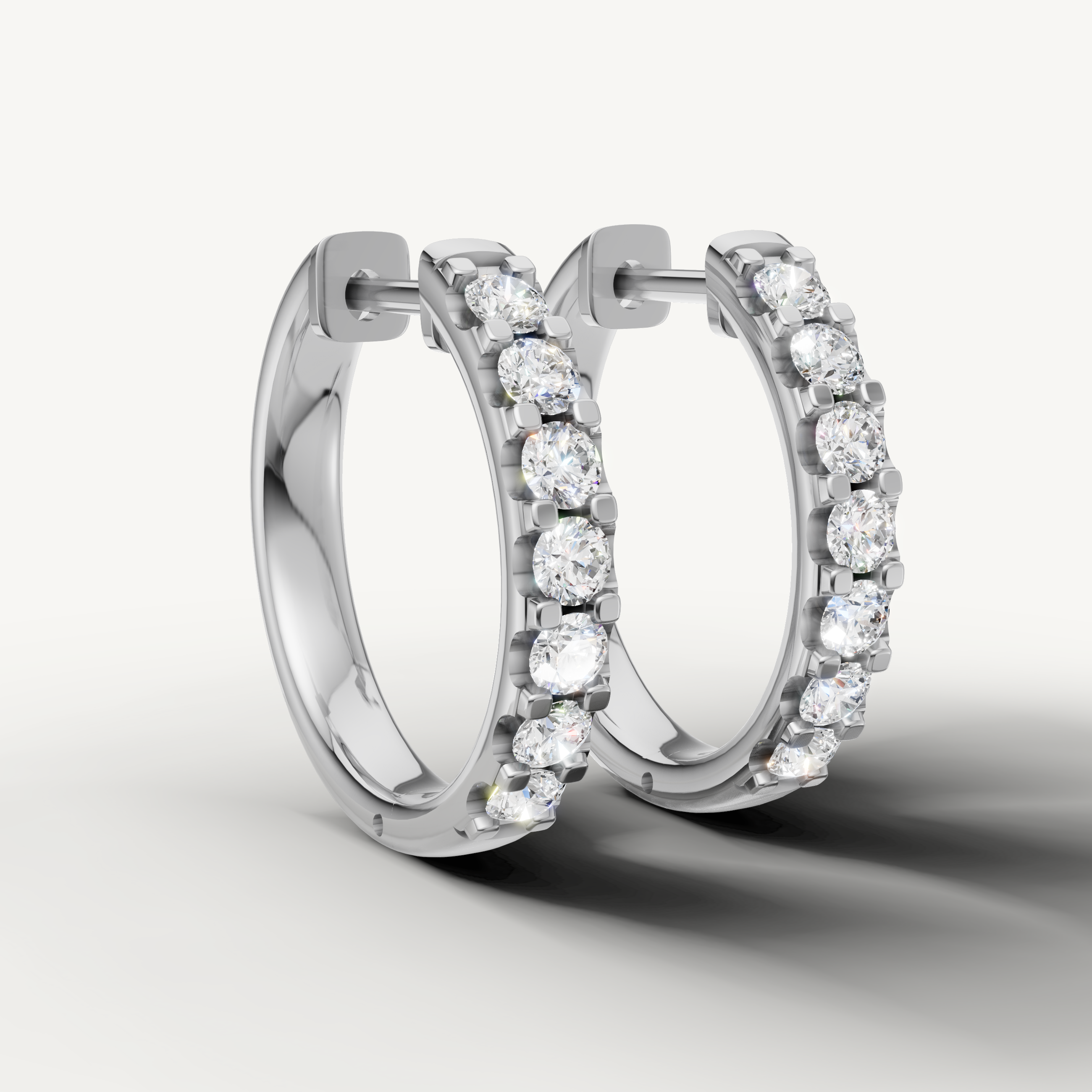 Luxury white gold round diamond hoop earrings for women with sparkling brilliance by Raul Diamonds