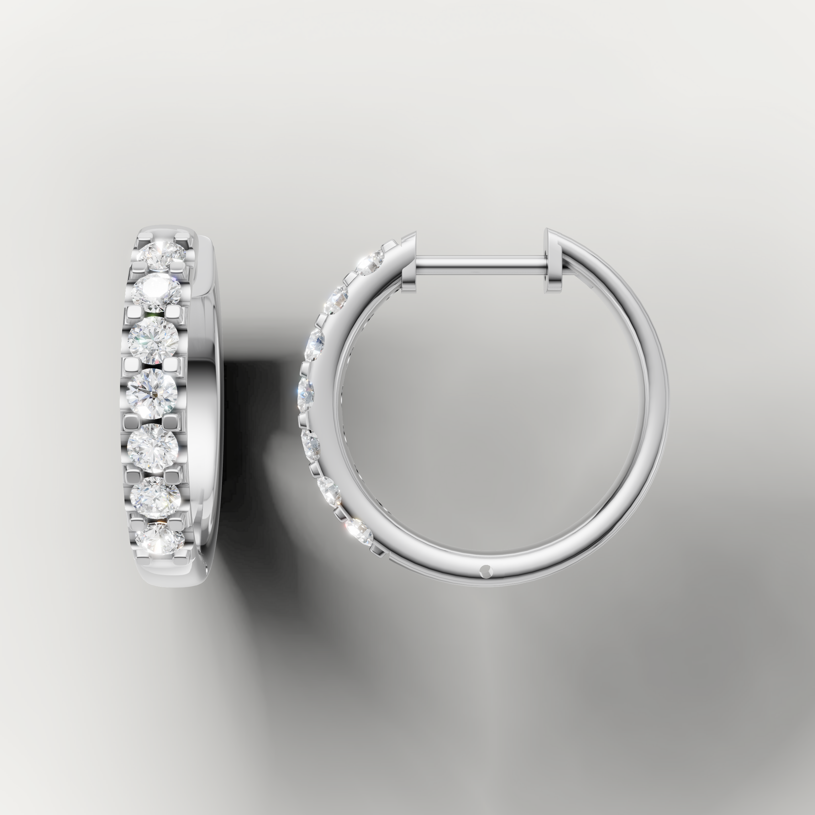 White gold diamond huggie hoop earrings by Raul Diamonds featuring timeless luxury elegance