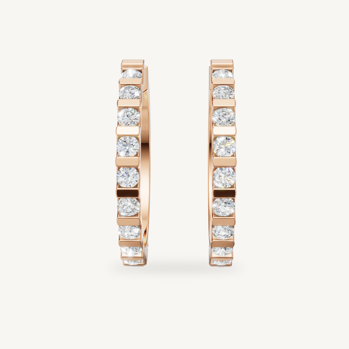 Rose gold bezel diamond huggie earrings by Raul Diamonds featuring elegant luxury craftsmanship