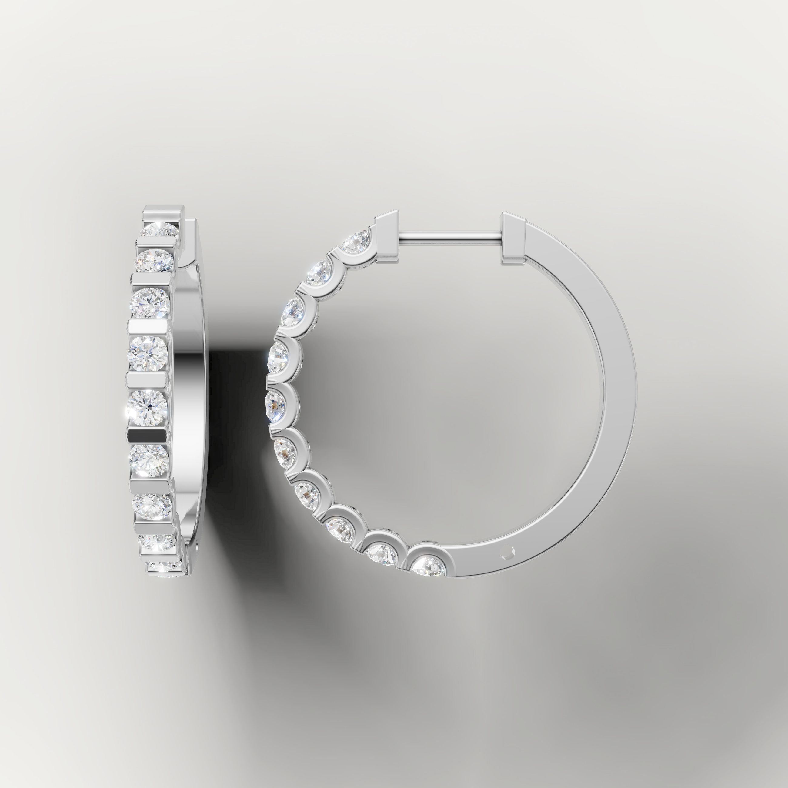 White gold diamond huggie hoop earrings by Raul Diamonds featuring modern luxury styling