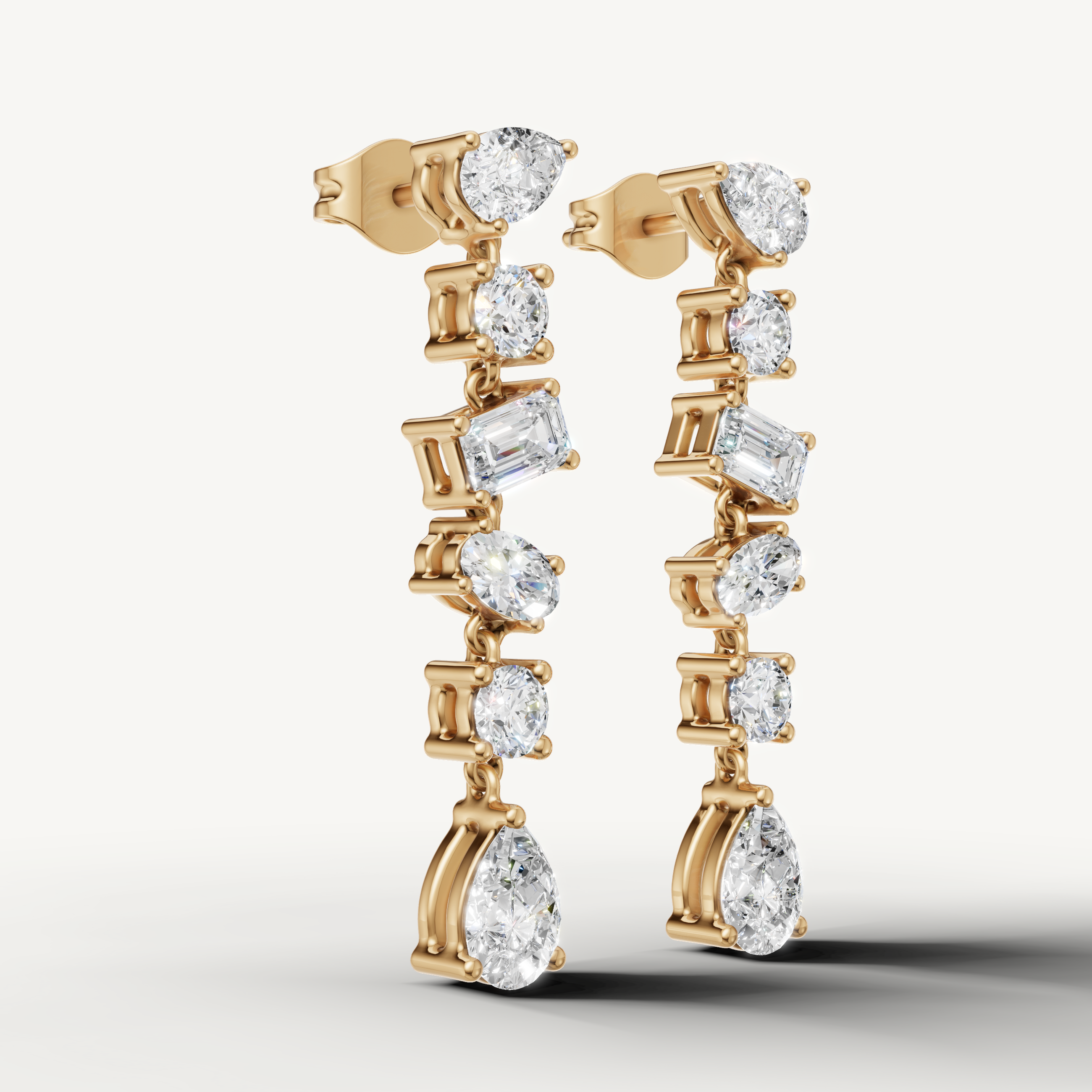 Luxury yellow gold mixed shape diamond drop earrings with elegant sparkle by Raul Diamonds