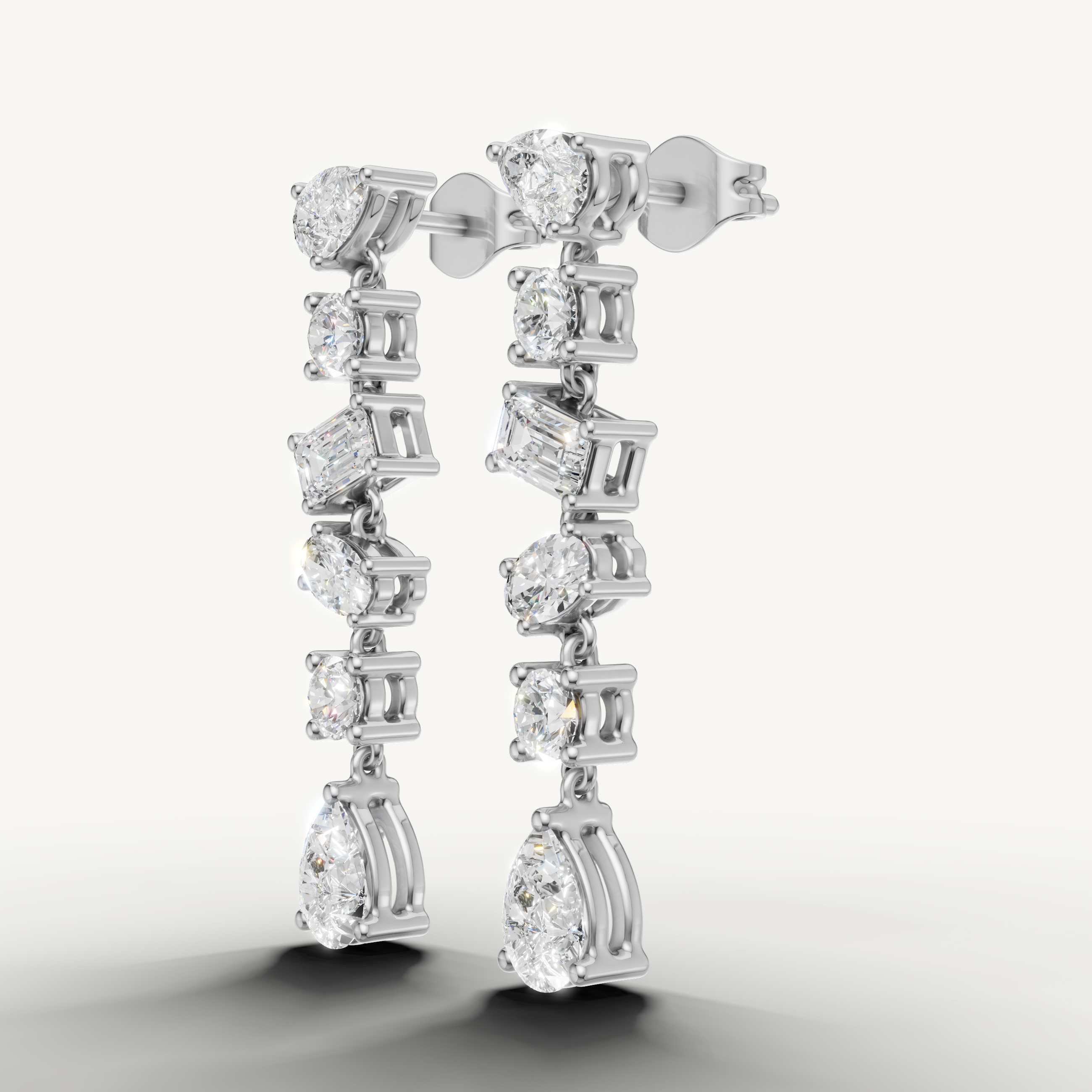 Raul Diamonds white gold designer diamond earrings with round and pear cut diamonds