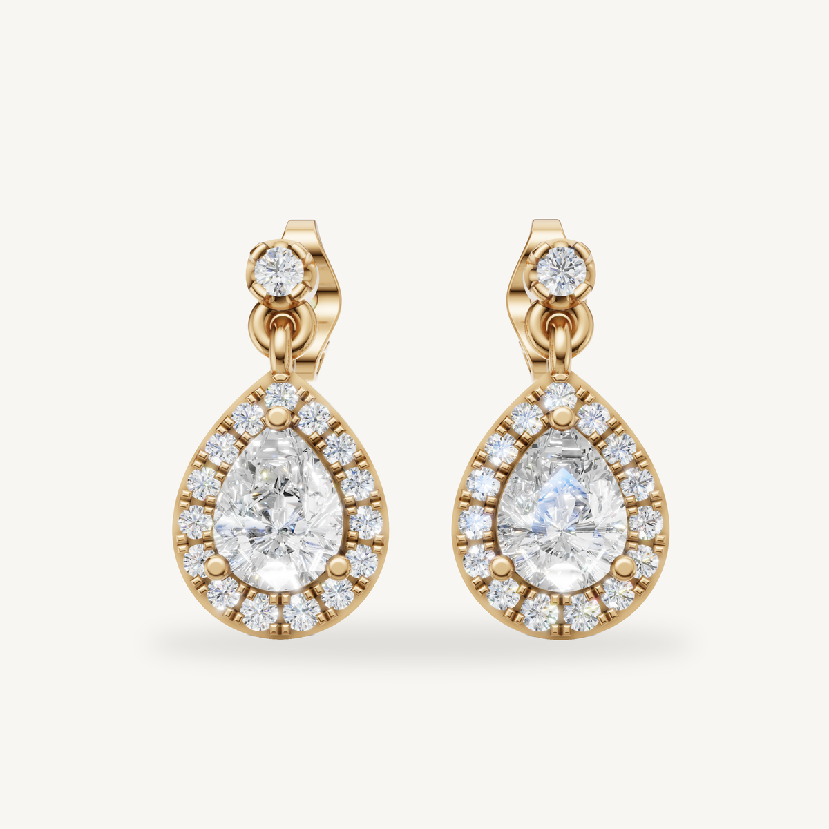 Raul Diamonds yellow gold pear shape halo diamond drop earrings with timeless elegance