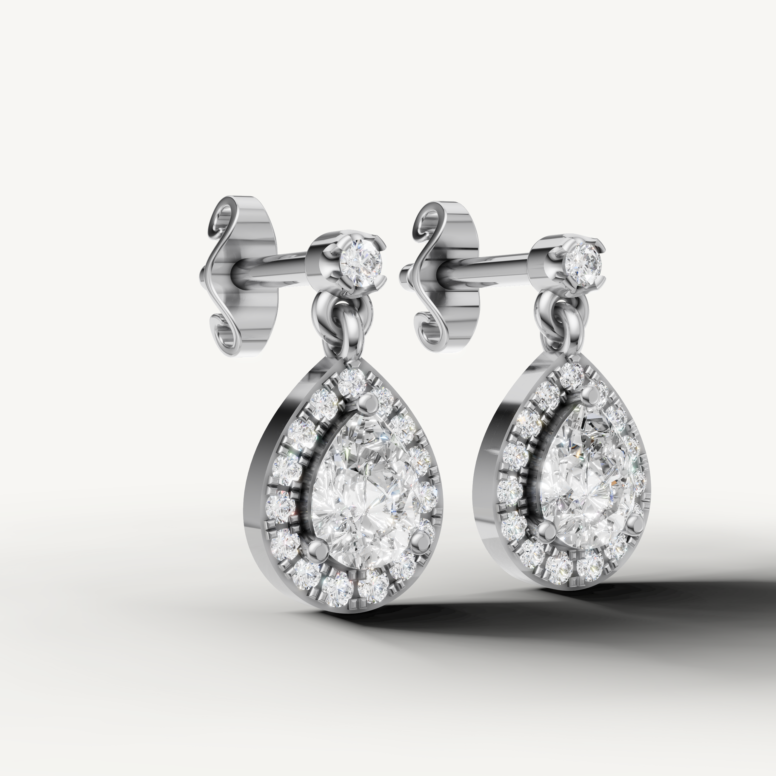 Luxury white gold teardrop halo diamond earrings with elegant craftsmanship by Raul Diamonds