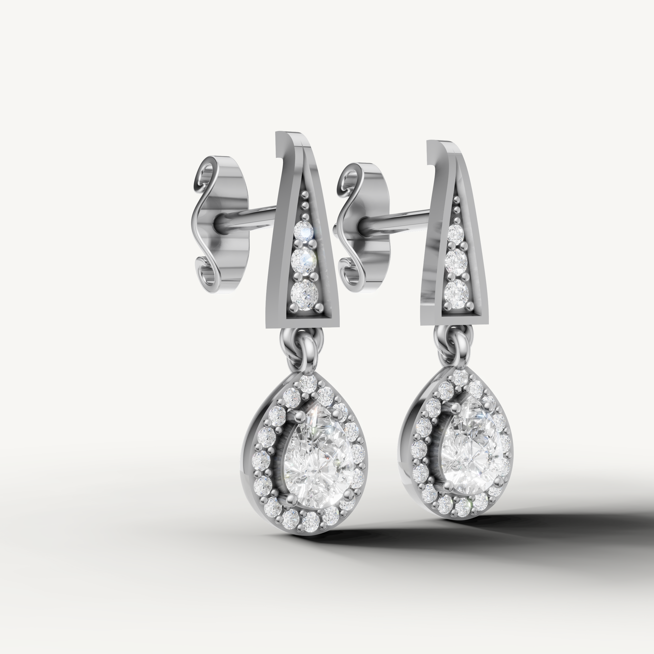 Luxury white gold pear cut halo diamond earrings with fine jewelry craftsmanship by Raul Diamonds