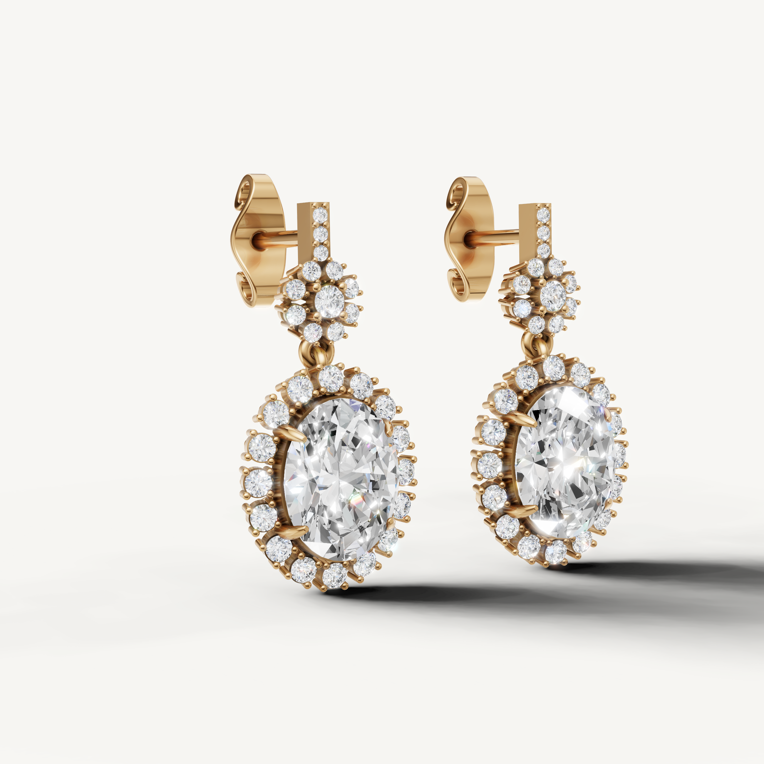 Luxury yellow gold statement diamond drop earrings with floral halo detailing by Raul Diamonds