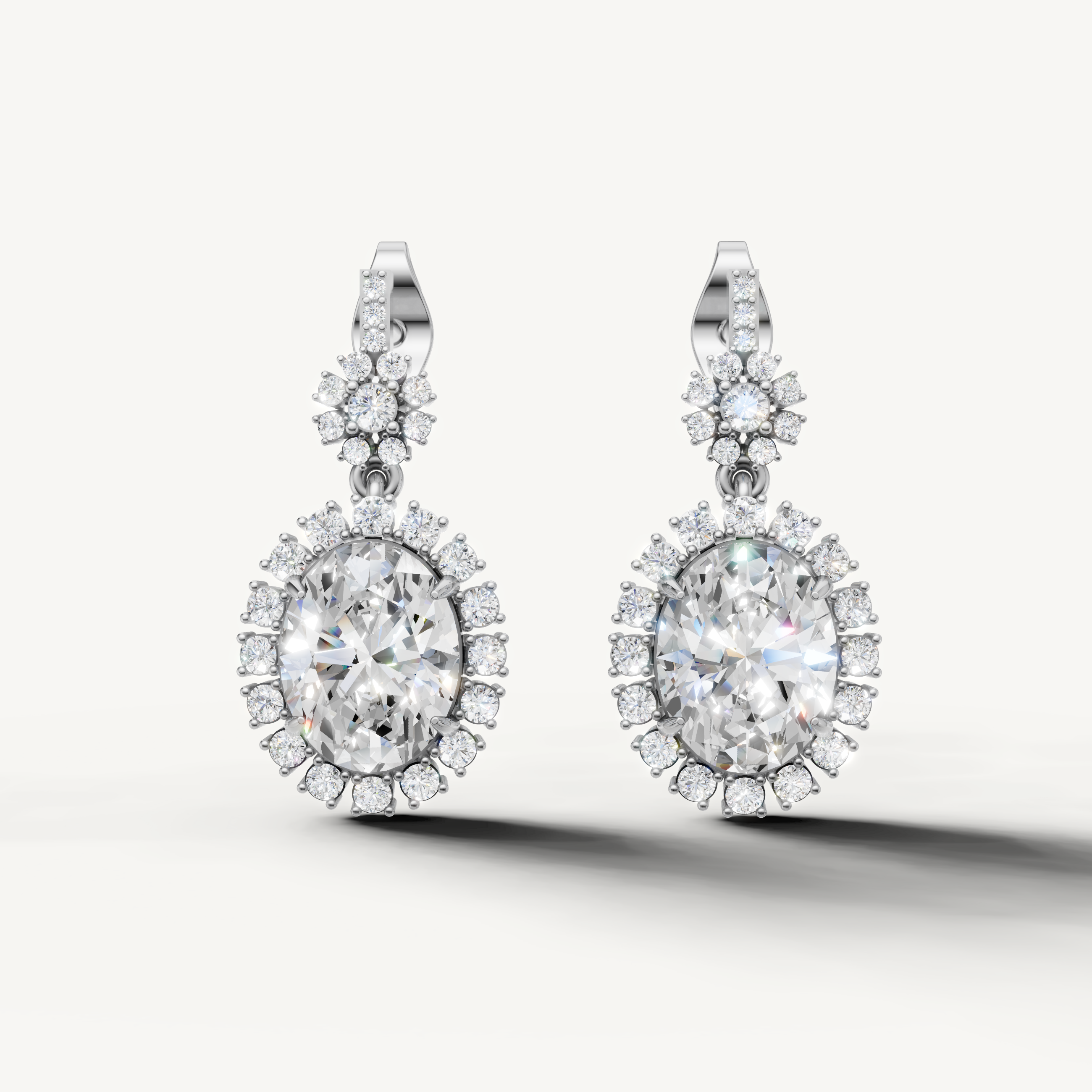 Raul Diamonds white gold oval diamond halo drop earrings with luxurious brilliance