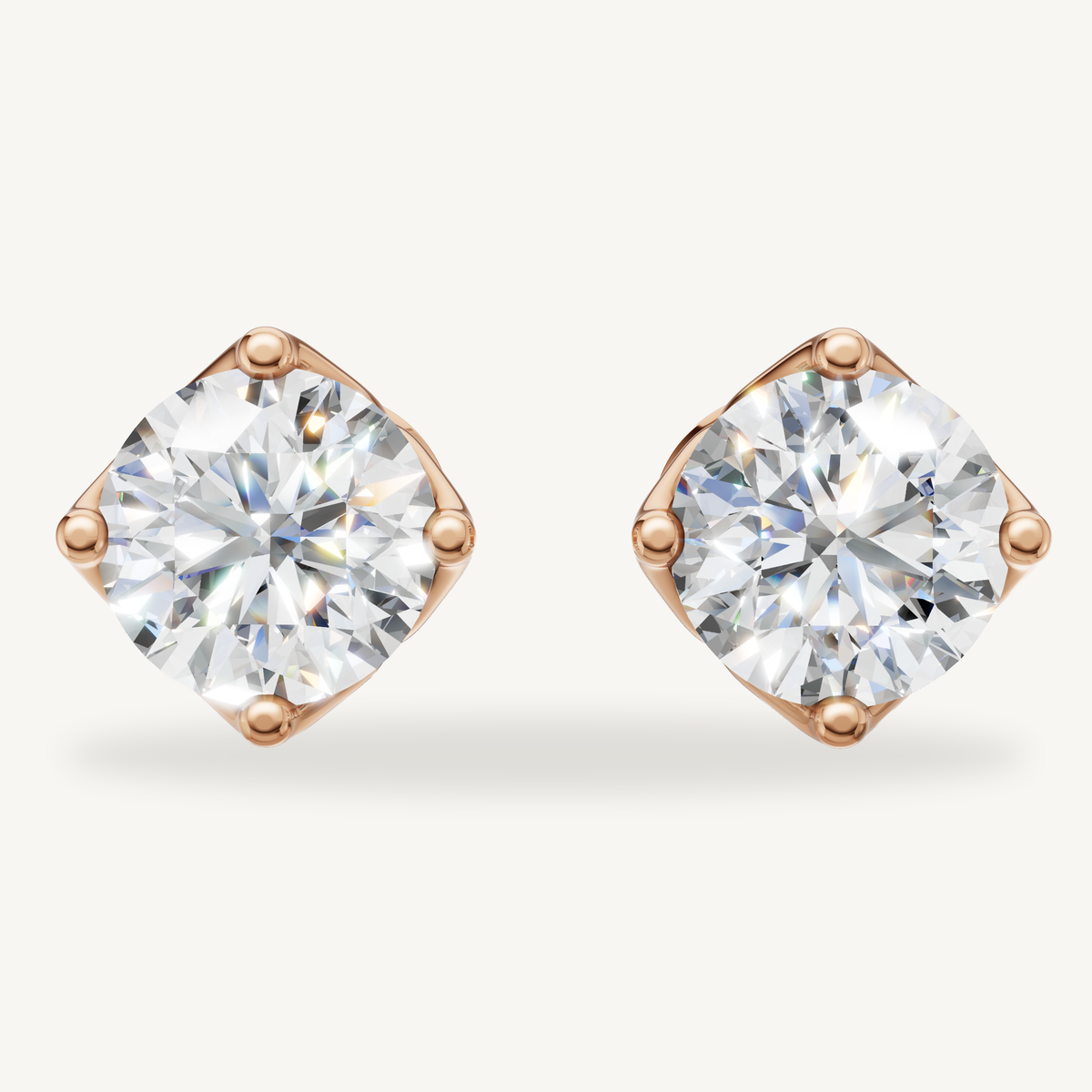 Round lab grown diamond stud earrings in 14K rose gold by Raul Diamonds