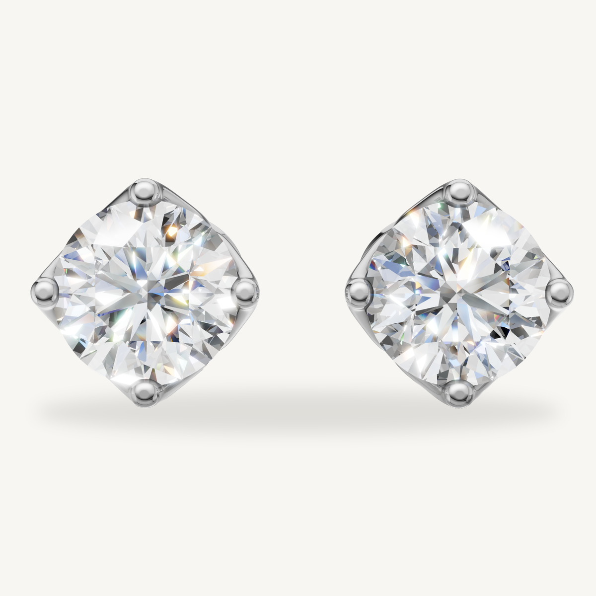 Round lab grown diamond stud earrings in 14K white gold by Raul Diamonds