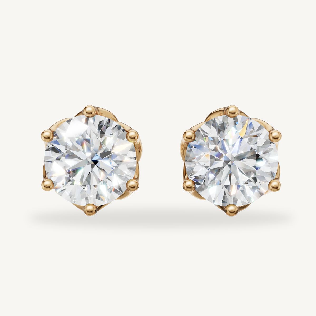 Round lab grown diamond stud earrings in 14K yellow gold by Raul Diamonds