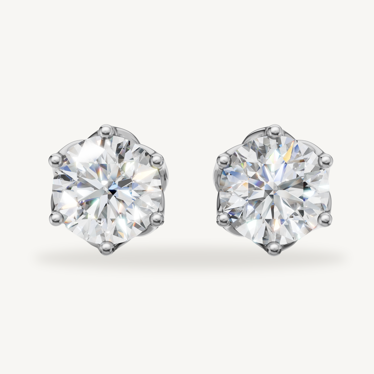 Round lab grown diamond stud earrings in 14K white gold by Raul Diamonds
