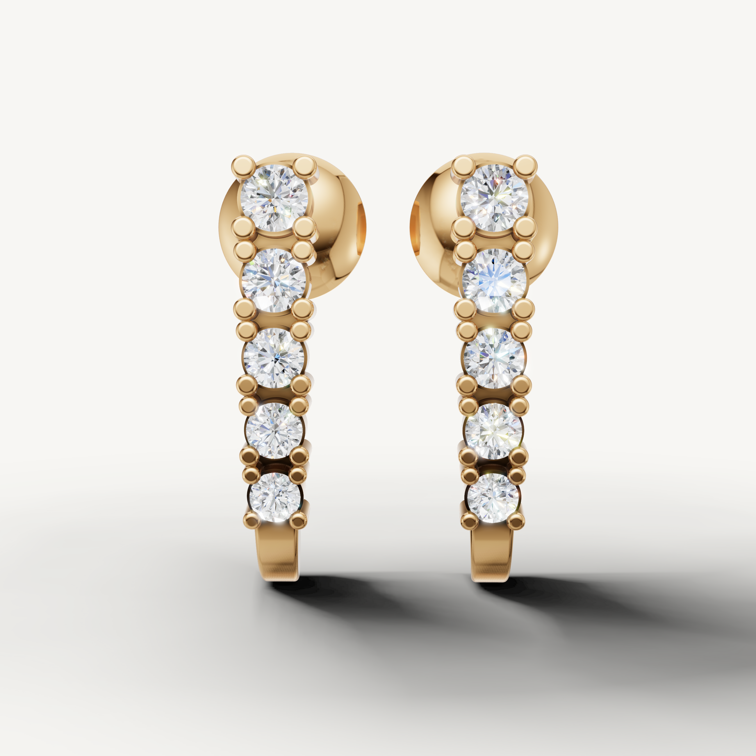Raul Diamonds yellow gold diamond hoop earrings with graduated round brilliant diamonds