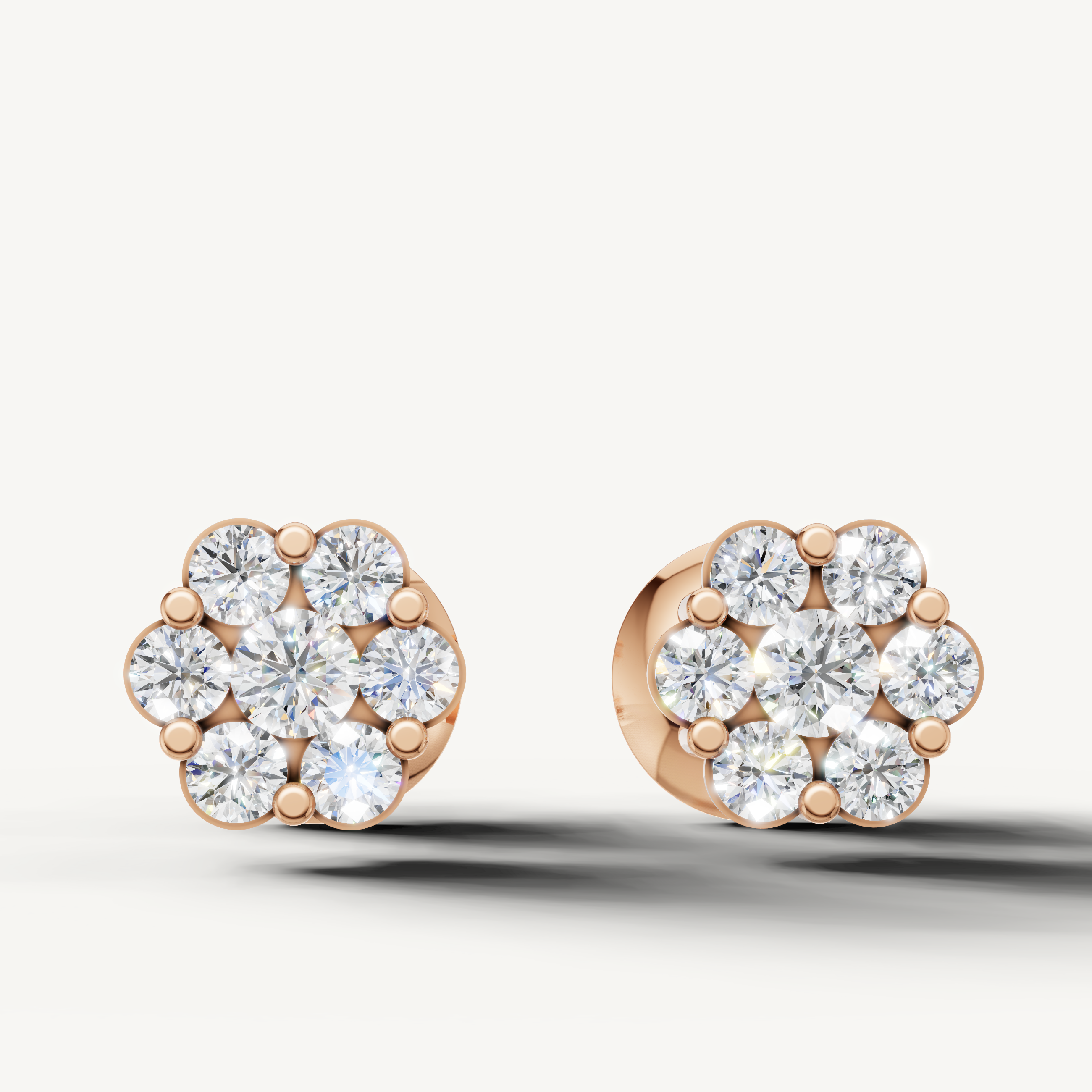 Floral cluster diamond stud earrings in 14K rose gold by Raul Diamonds