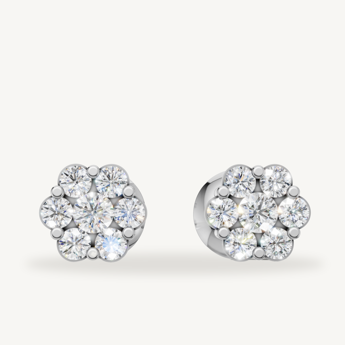 Floral cluster diamond stud earrings in 14K white gold by Raul Diamonds