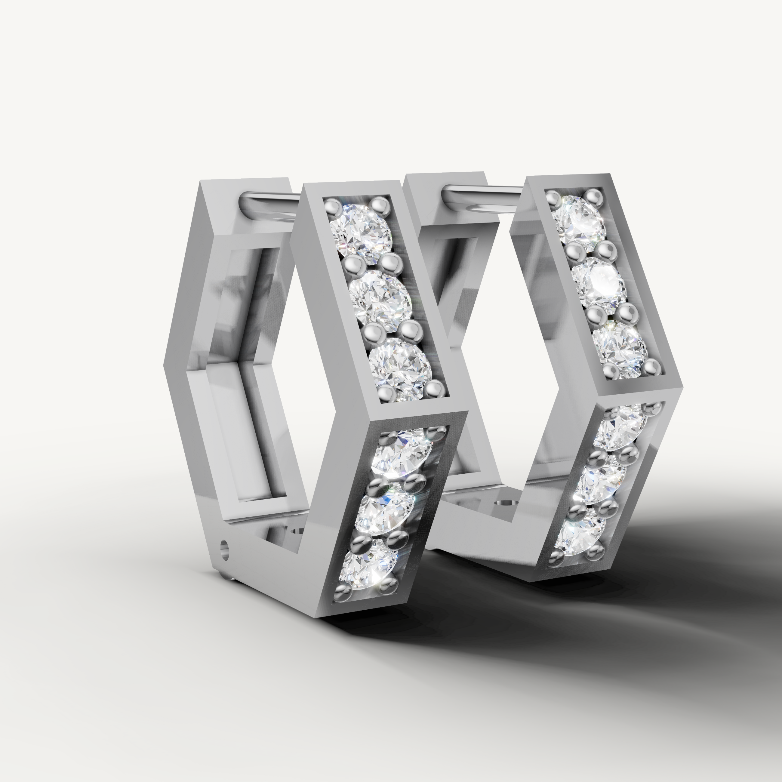 Elegant white gold geometric hoop earrings for women crafted with fine diamonds by Raul Diamonds