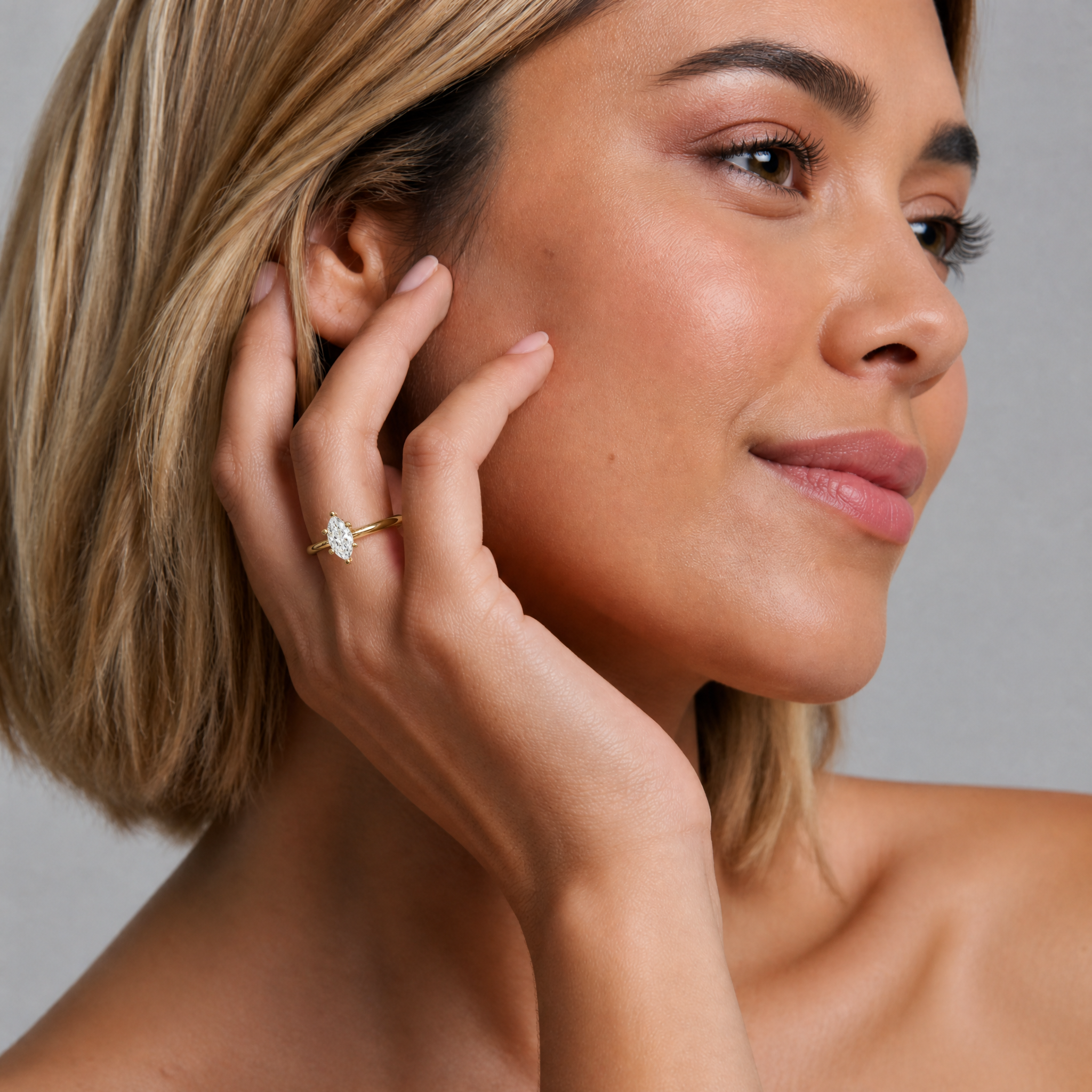 High-jewelry model Alessandra Cavalli showcasing a Raul Diamonds marquise cut engagement ring, highlighting how the elongated diamond shape creates a slender, elegant look