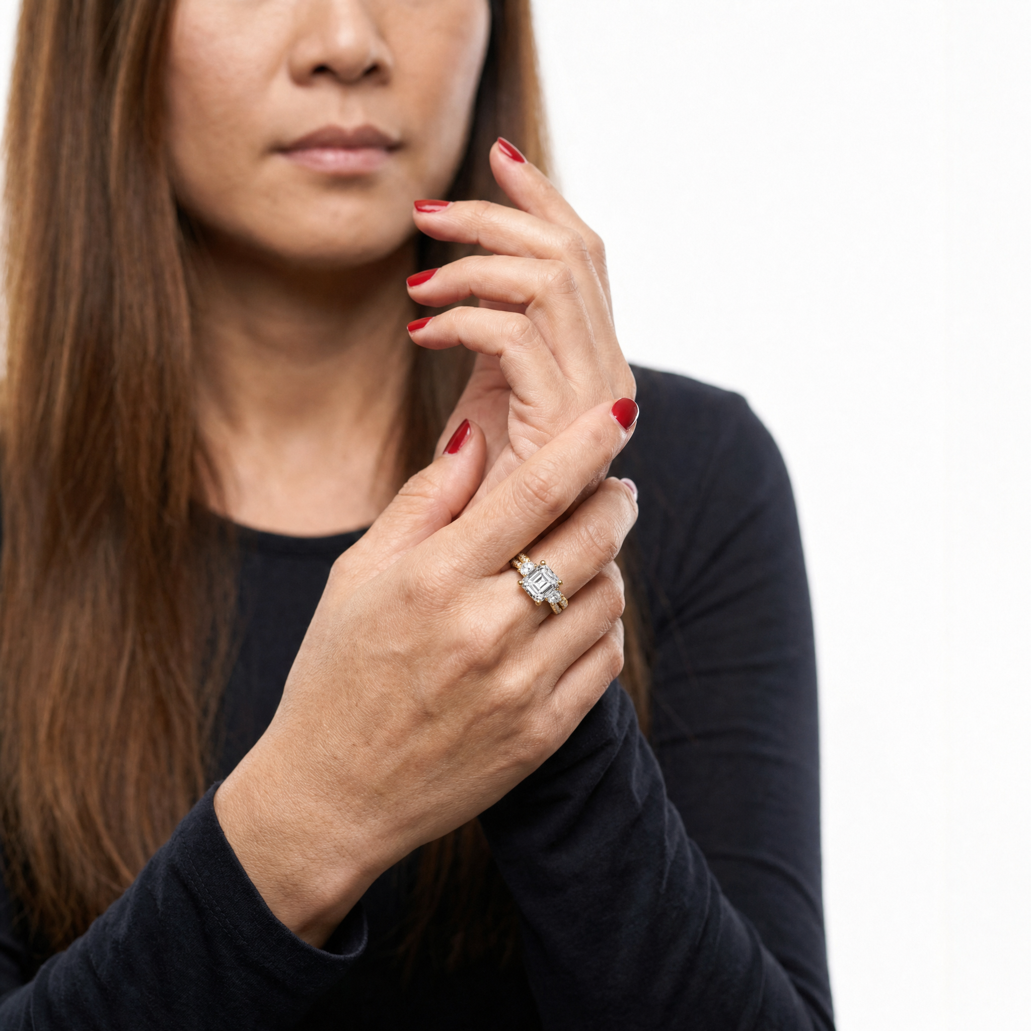 Elegant Model Wearing Asscher Cut Three Stone Lab Grown Diamond Engagement Ring in 14K Yellow Gold – Raul Diamonds