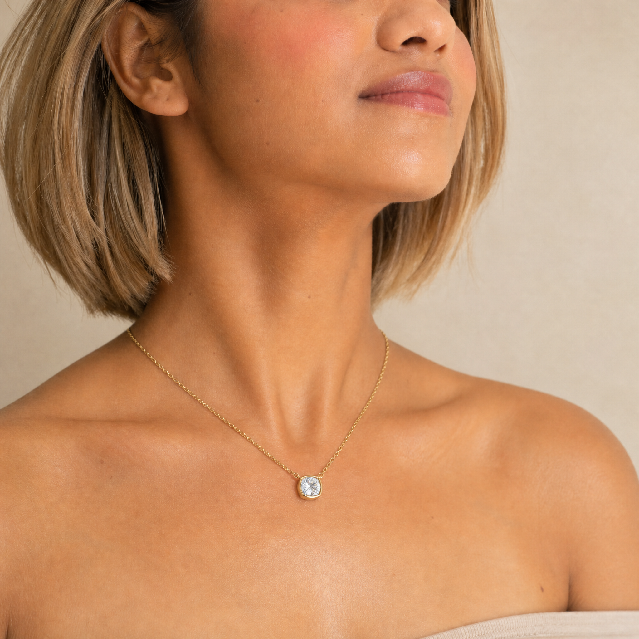 Female Model Wearing Cushion Cut Lab Grown Diamond Bezel Pendant Necklace in 14K Gold by Raul Diamonds