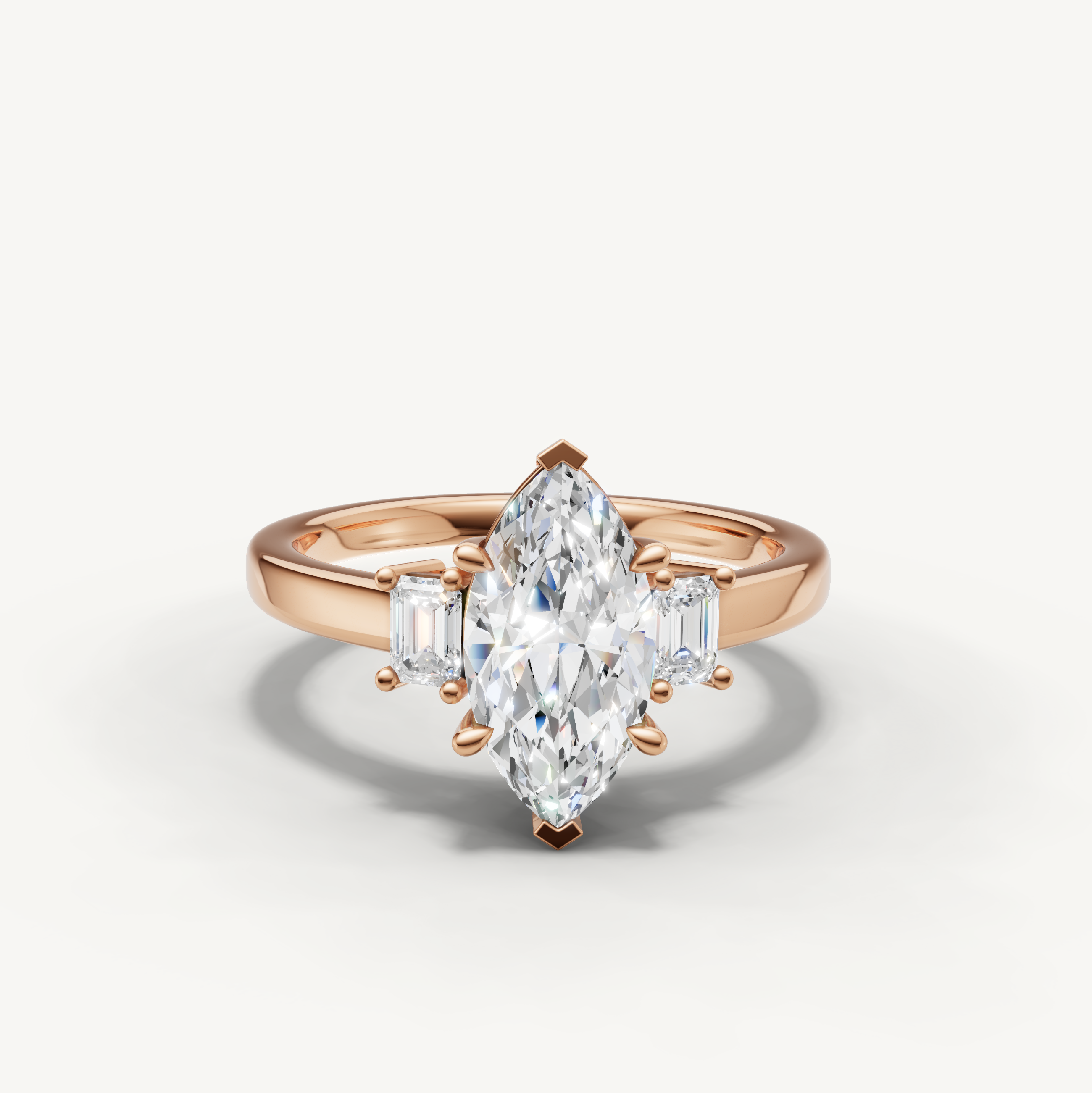 14K rose gold marquise lab grown diamond ring with tapered baguette side diamonds and polished band