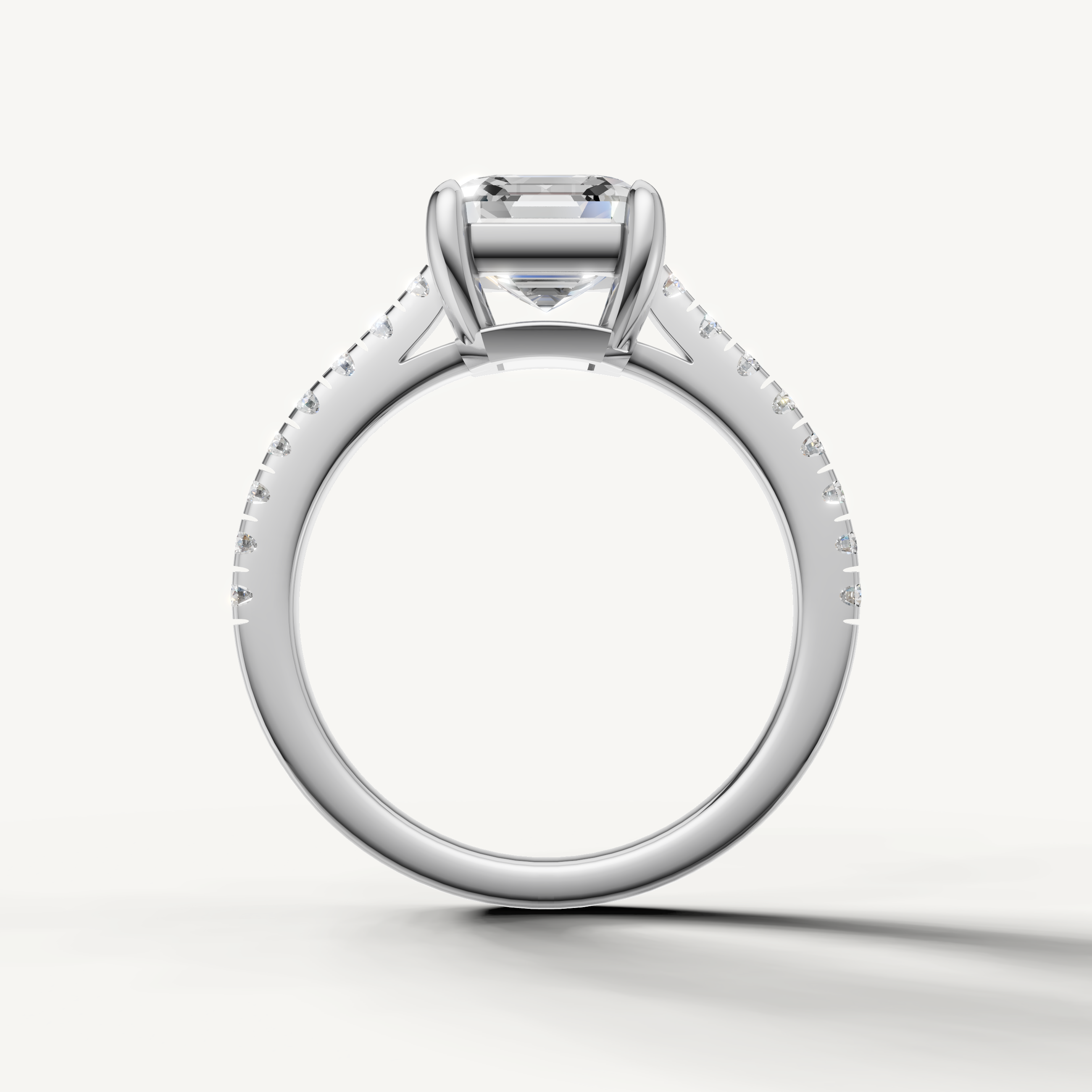 Elegant white gold emerald cut diamond engagement ring with sparkling pavé band