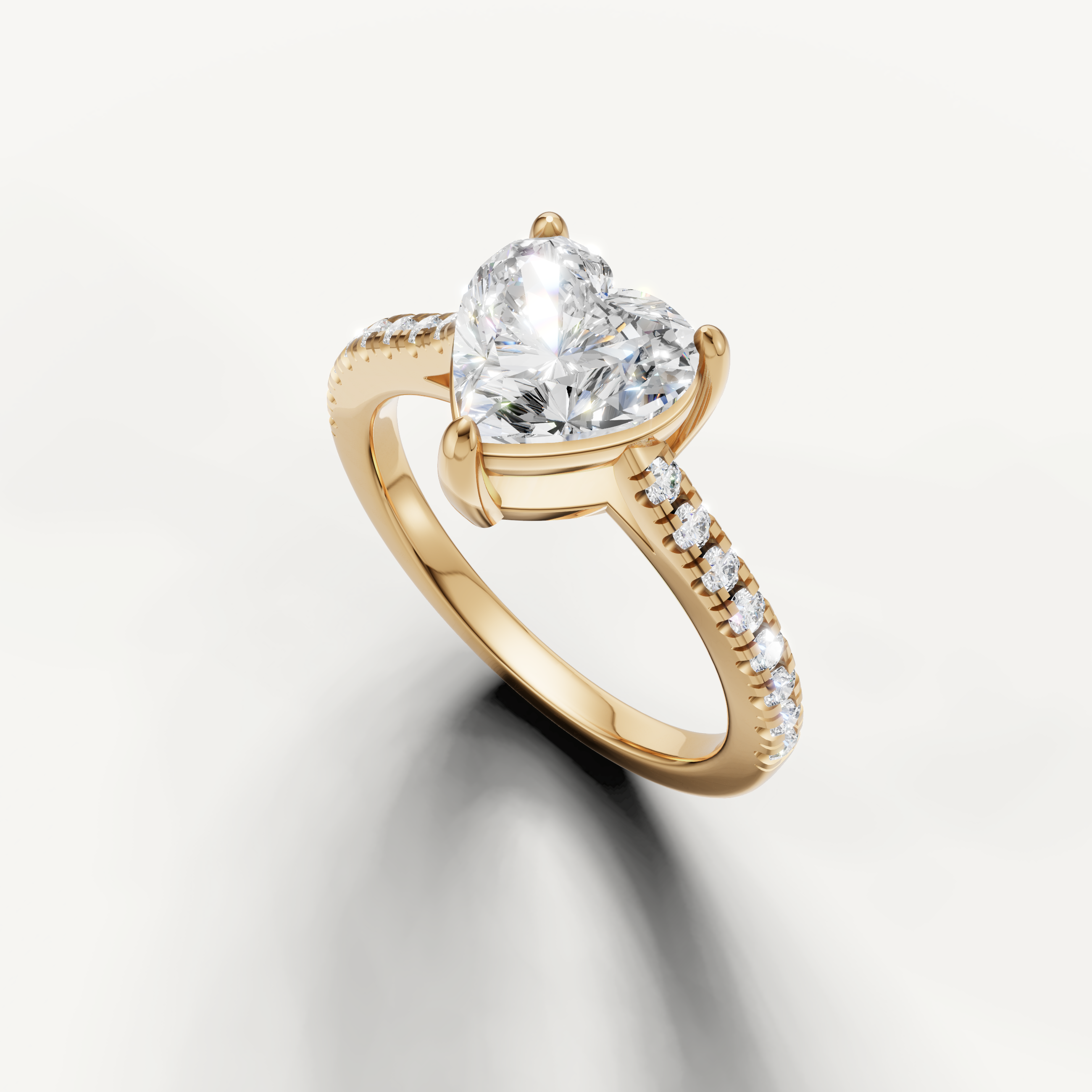 Classic heart shape lab grown diamond ring in yellow gold with pavé set band