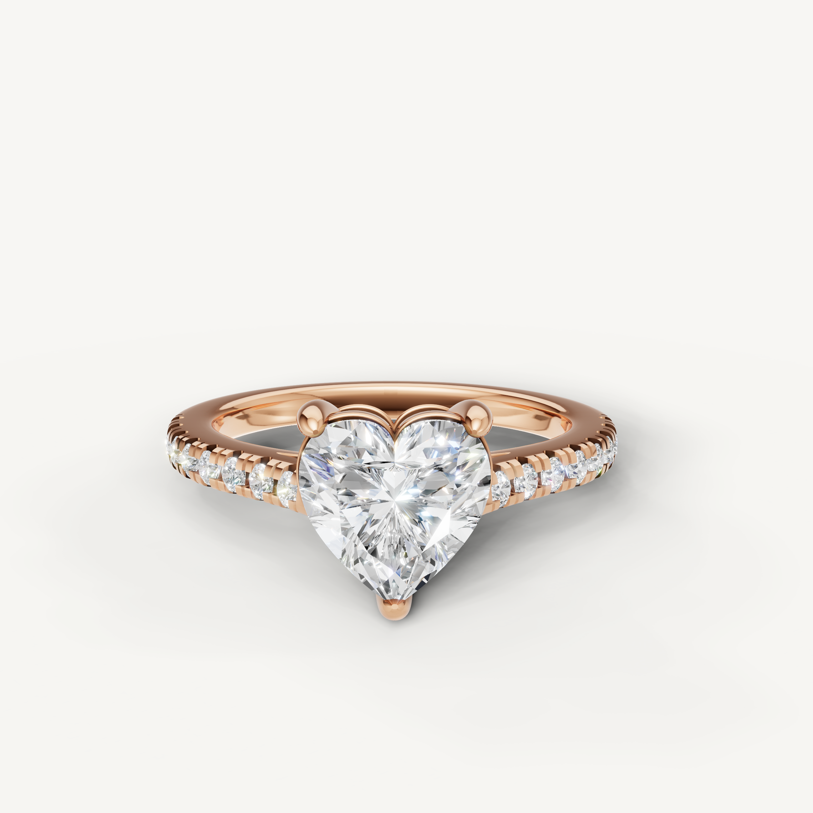 Heart shaped lab grown diamond engagement ring in 14K rose gold with pavé diamond band
