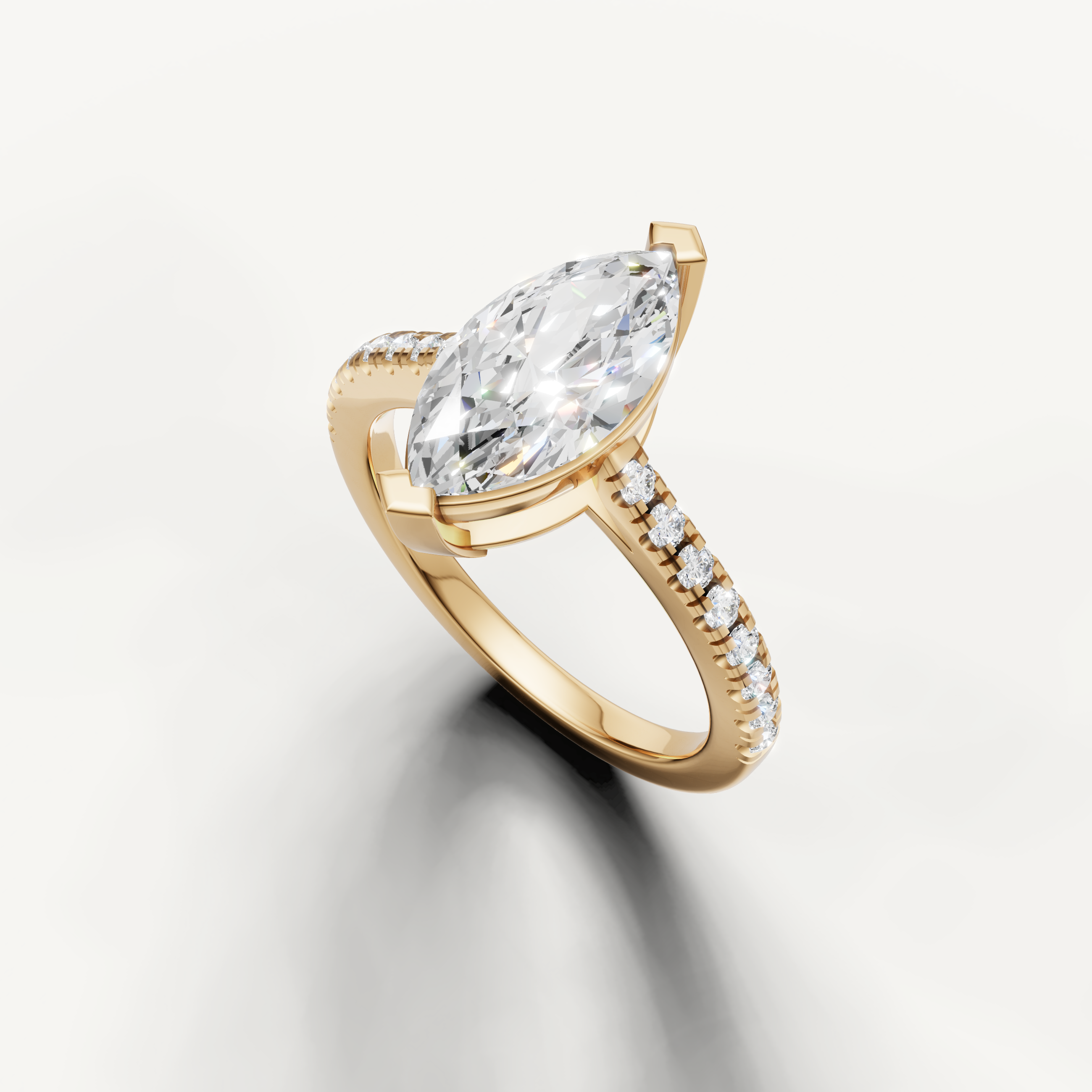 Elegant marquise cut diamond ring in yellow gold with pavé set band