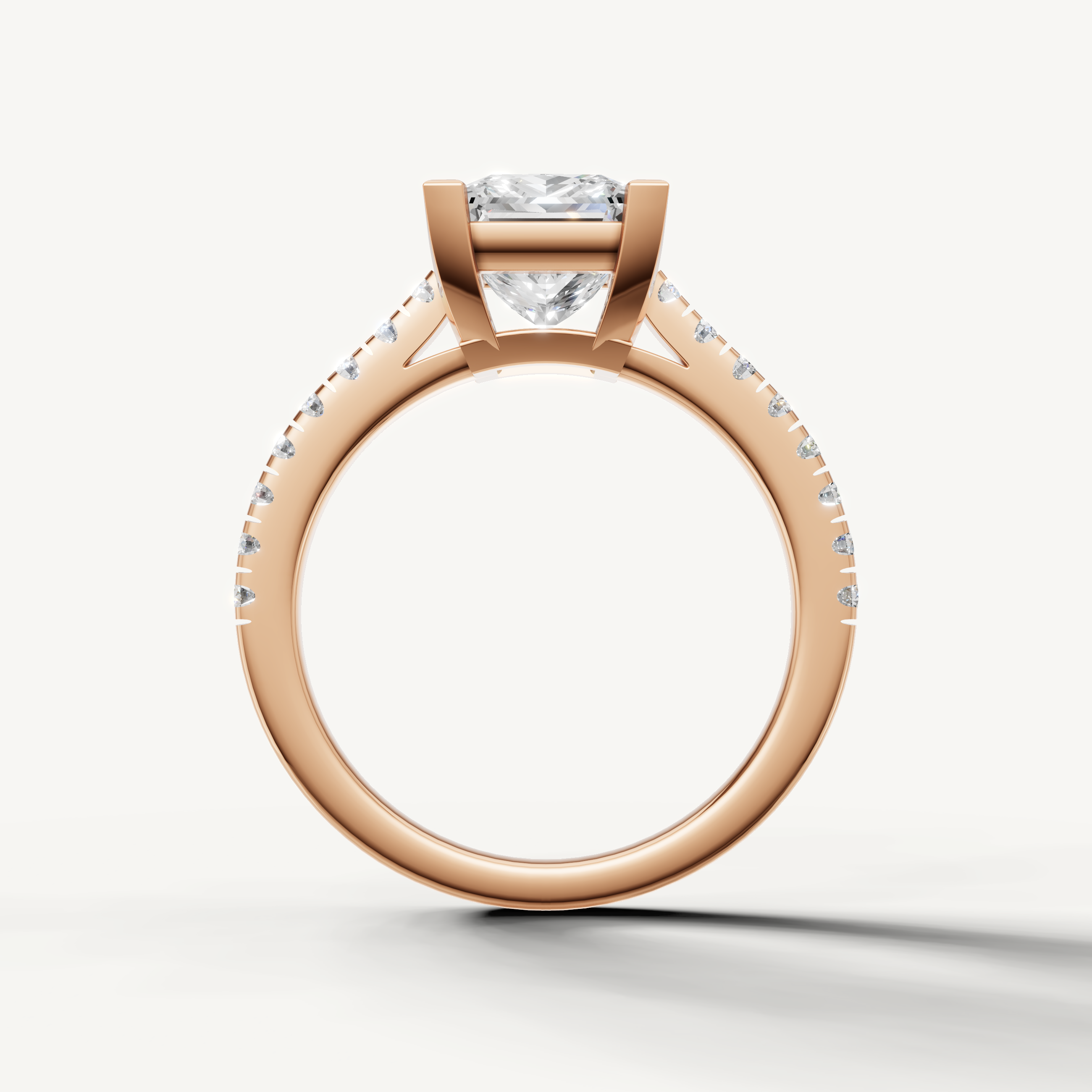 Elegant rose gold princess cut diamond engagement ring with pavé diamond band