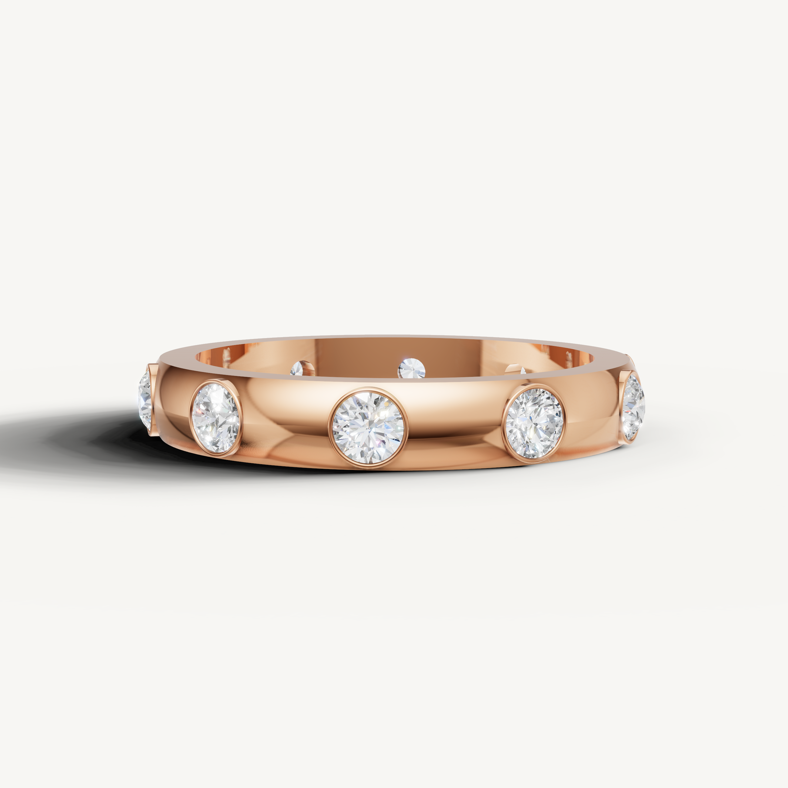 bezel set round lab grown diamond eternity band in 14k rose gold