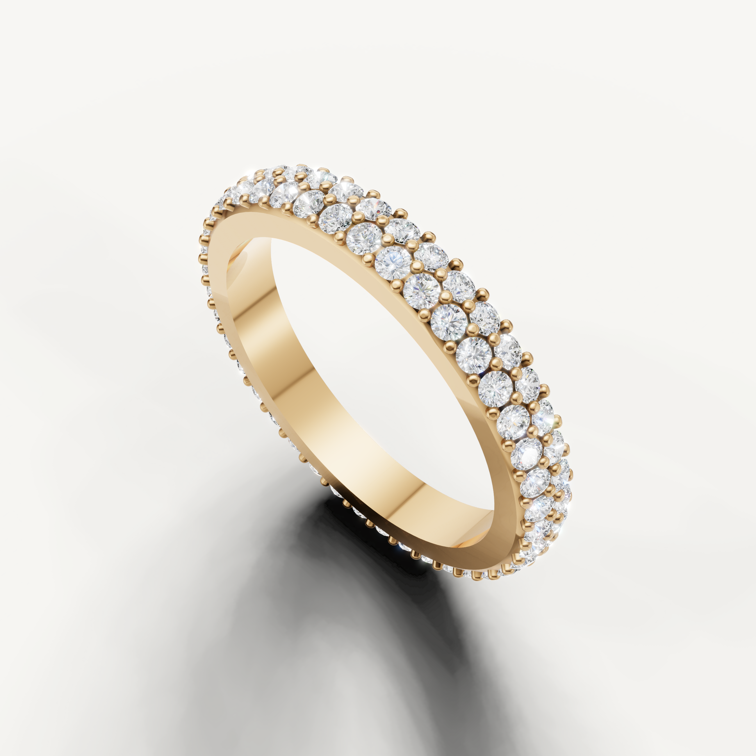 Luxury yellow gold eternity wedding band by Raul Diamonds with sparkling pavé diamonds