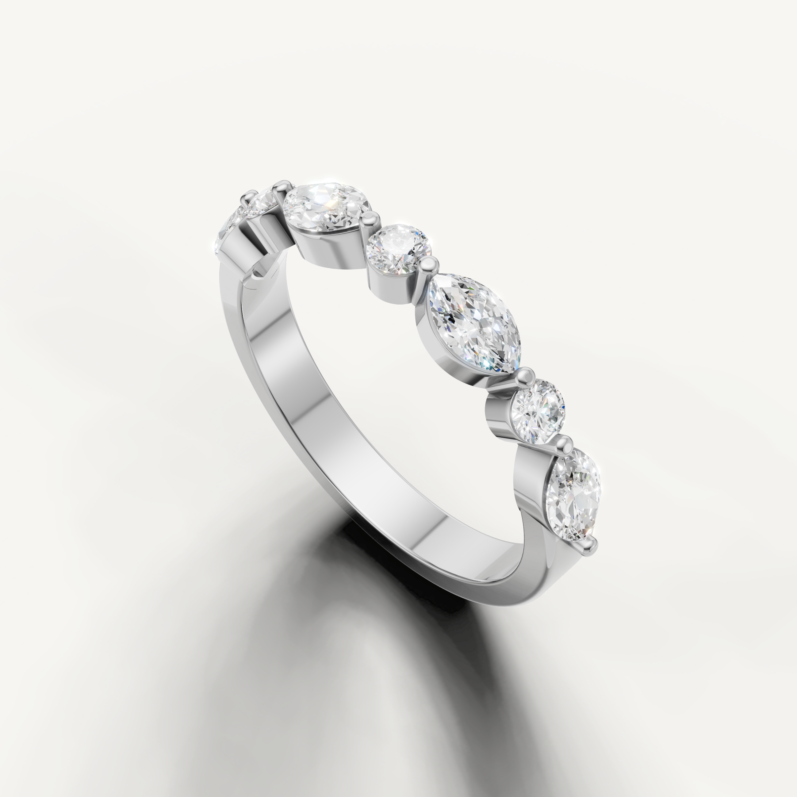 Luxury white gold anniversary band by Raul Diamonds with brilliant mixed shape diamond arrangement