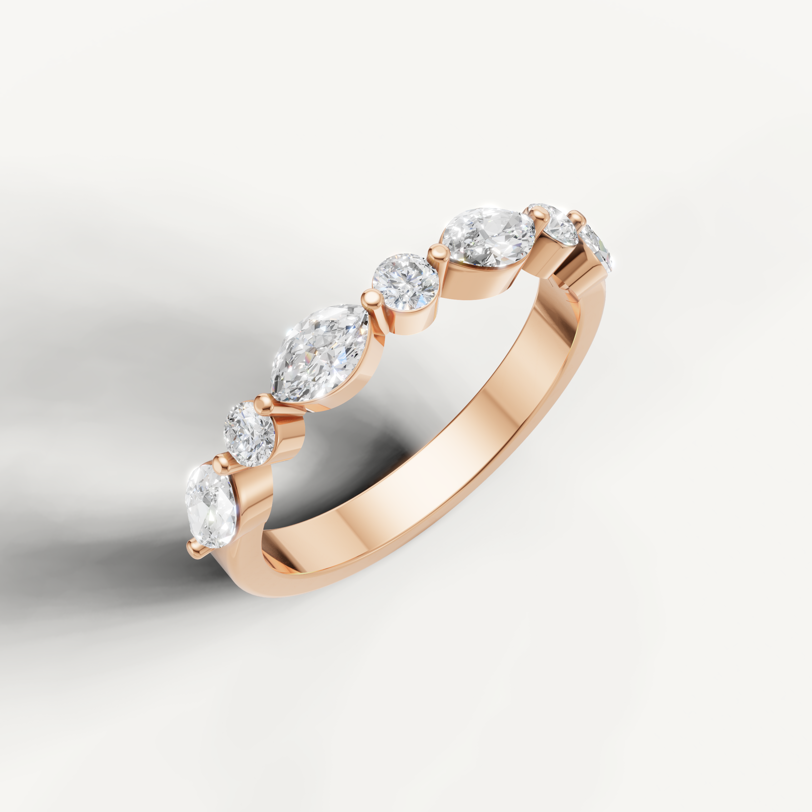 Romantic rose gold diamond wedding band by Raul Diamonds with brilliant pear shaped diamond details