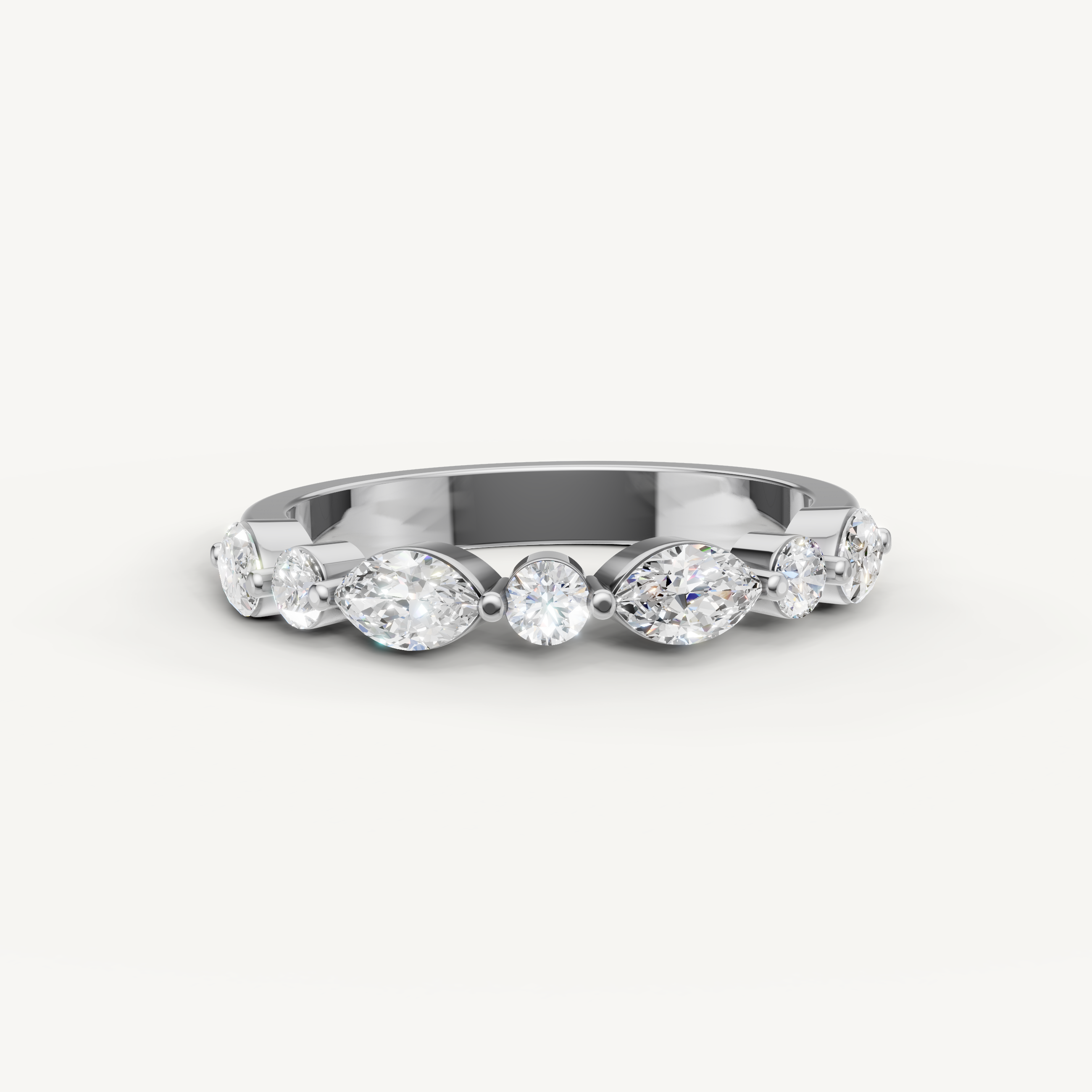 Raul Diamonds white gold wedding band with pear and round cut diamonds in a timeless shared prong setting