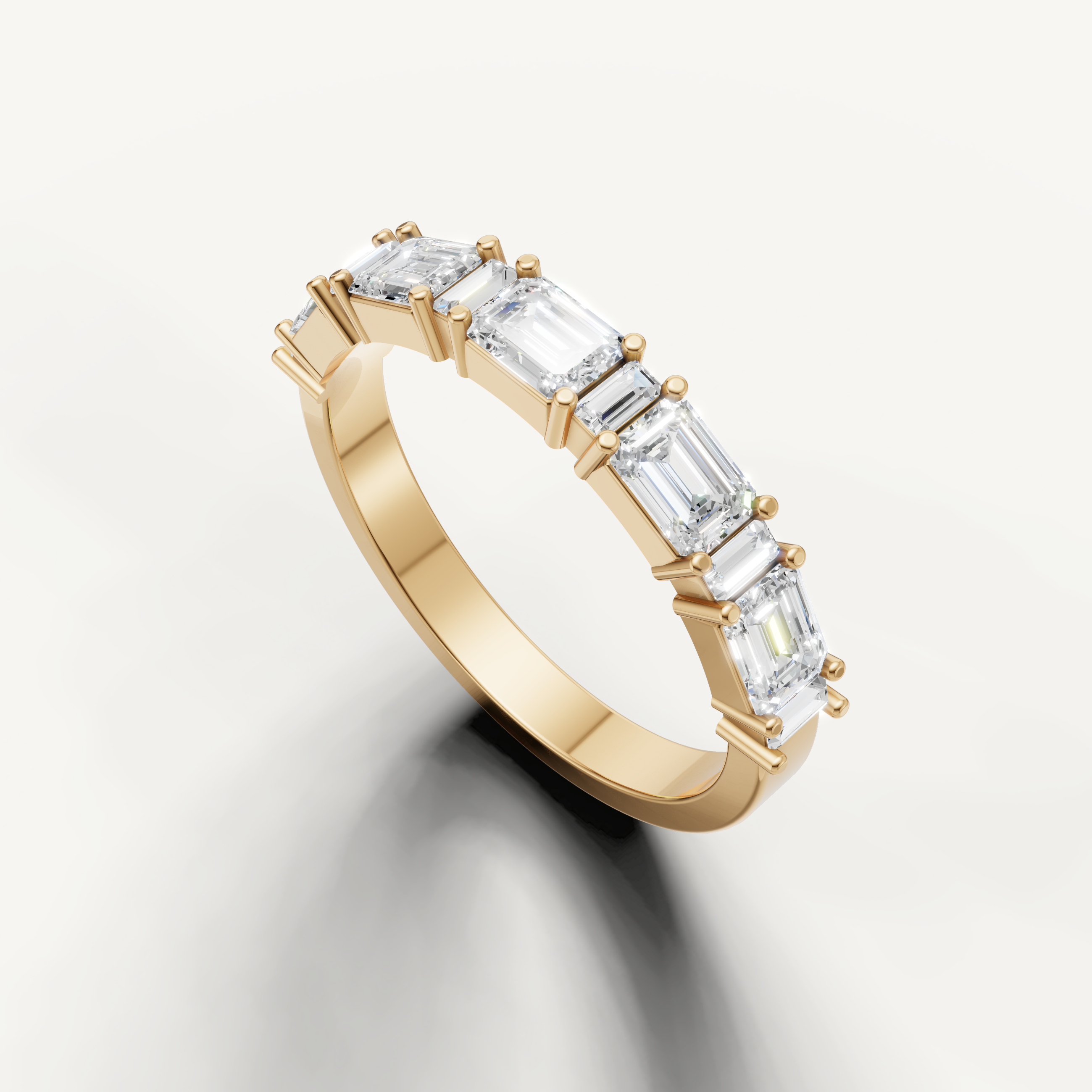 Raul Diamonds fine yellow gold anniversary band featuring horizontal emerald cut diamonds in a sleek setting