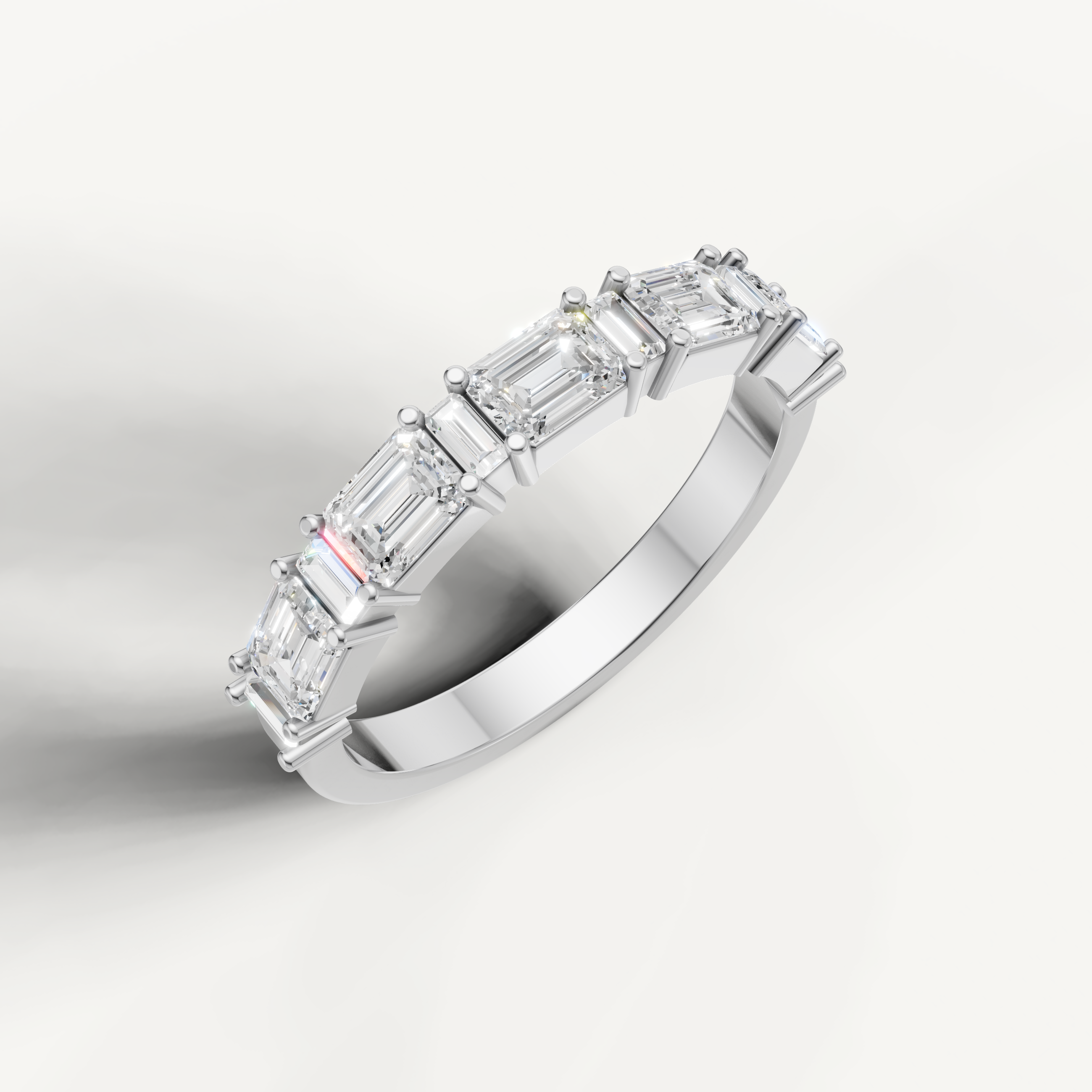 Elegant white gold emerald cut diamond wedding ring by Raul Diamonds with brilliant step cut stones