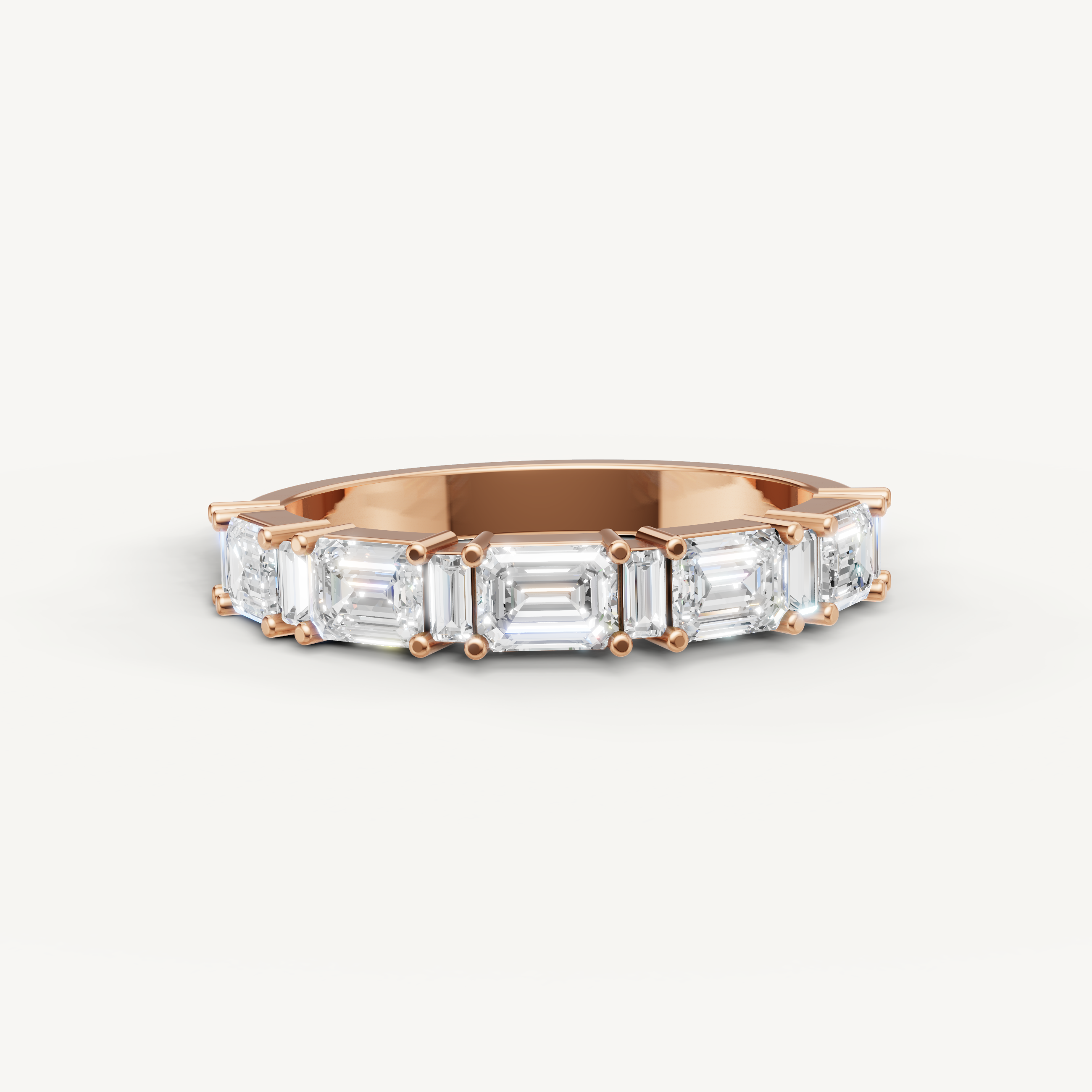 Raul Diamonds rose gold wedding band with emerald cut lab grown diamonds in a contemporary eternity design