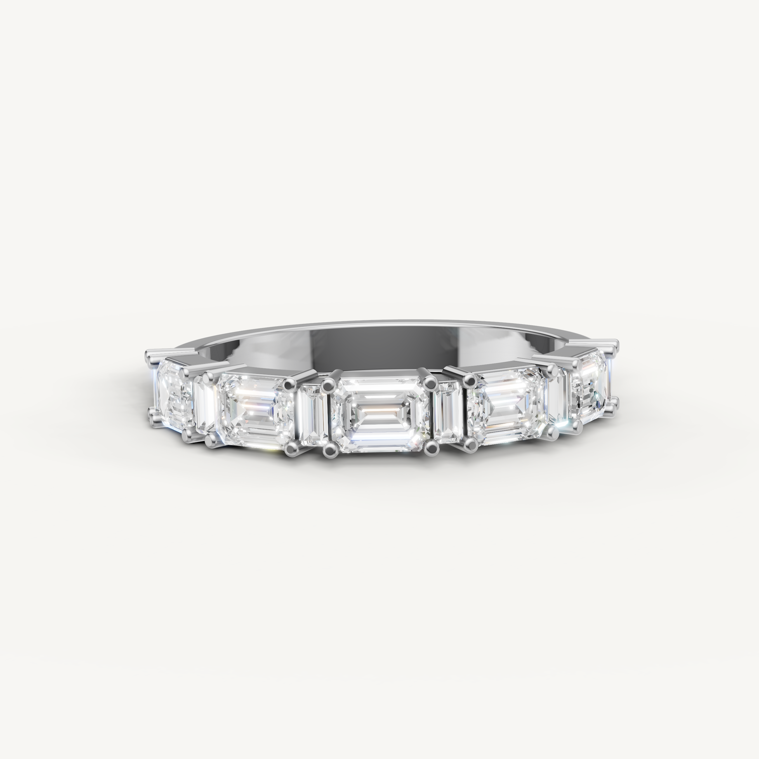 Raul Diamonds white gold wedding band with emerald cut lab grown diamonds in a classic eternity setting