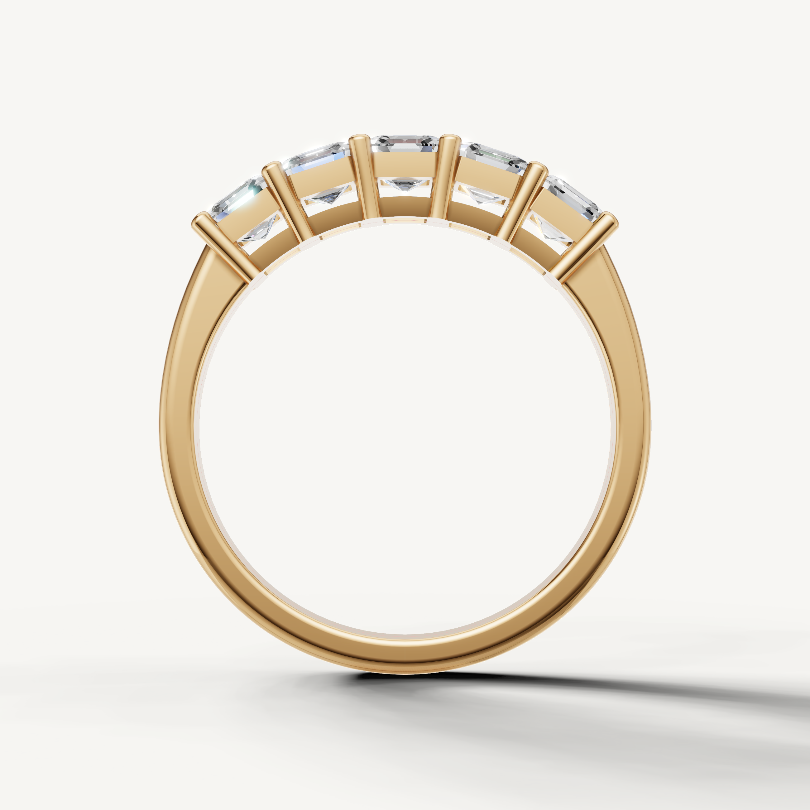 Raul Diamonds fine yellow gold wedding ring with Asscher cut lab grown diamonds in a sleek shared prong design
