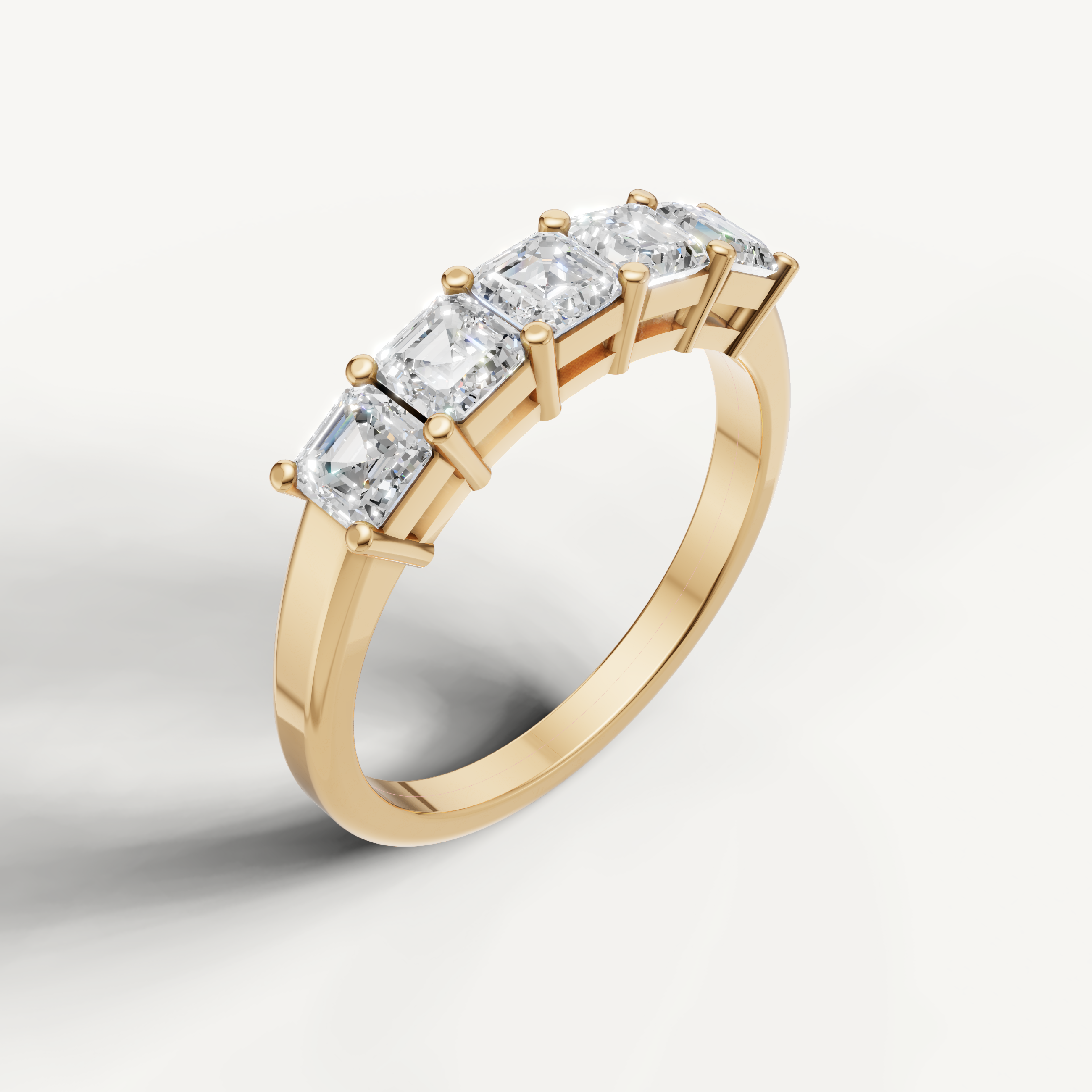 Elegant yellow gold Asscher cut diamond wedding band by Raul Diamonds with timeless step cut brilliance