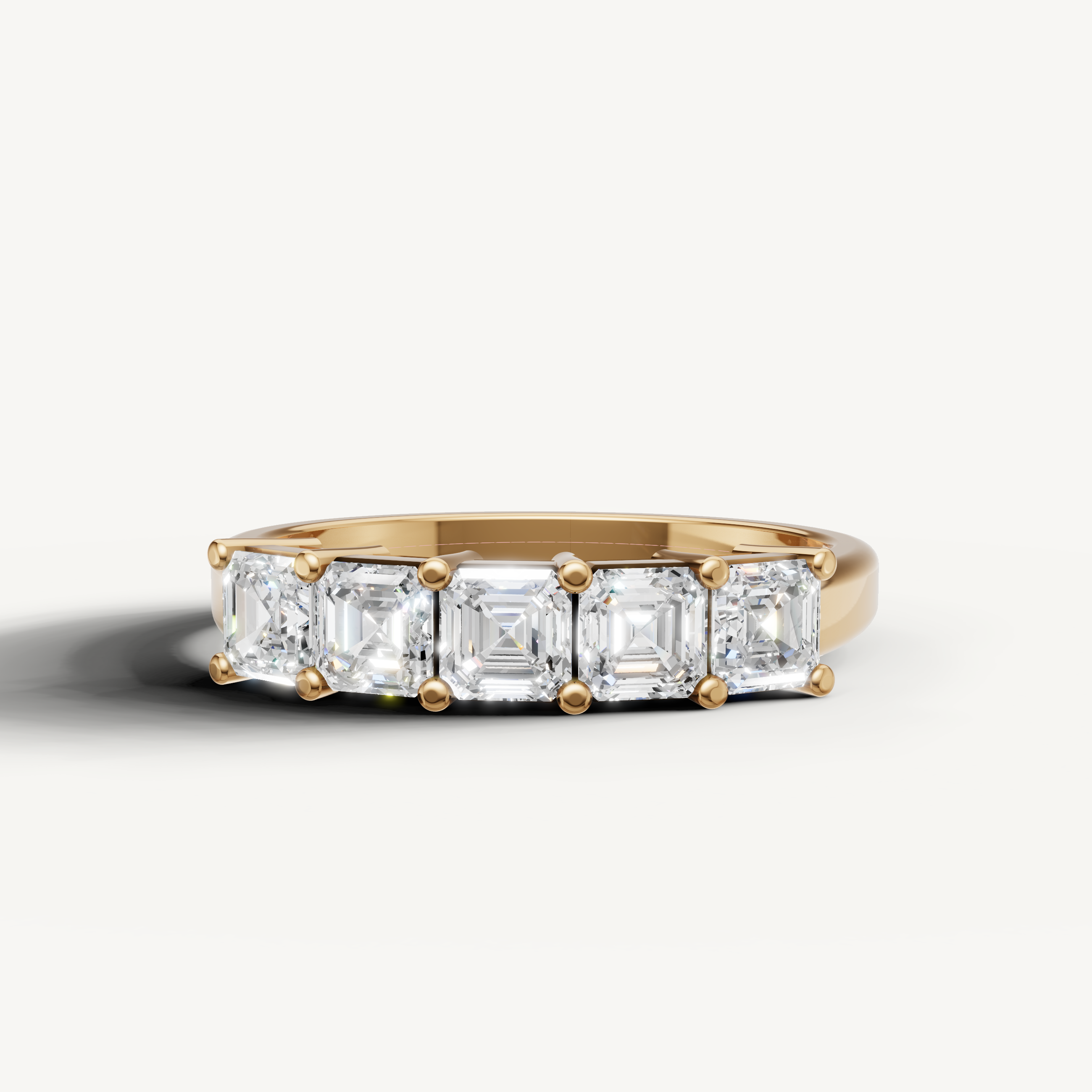 Raul Diamonds yellow gold wedding band with Asscher cut lab grown diamonds in a modern five stone setting