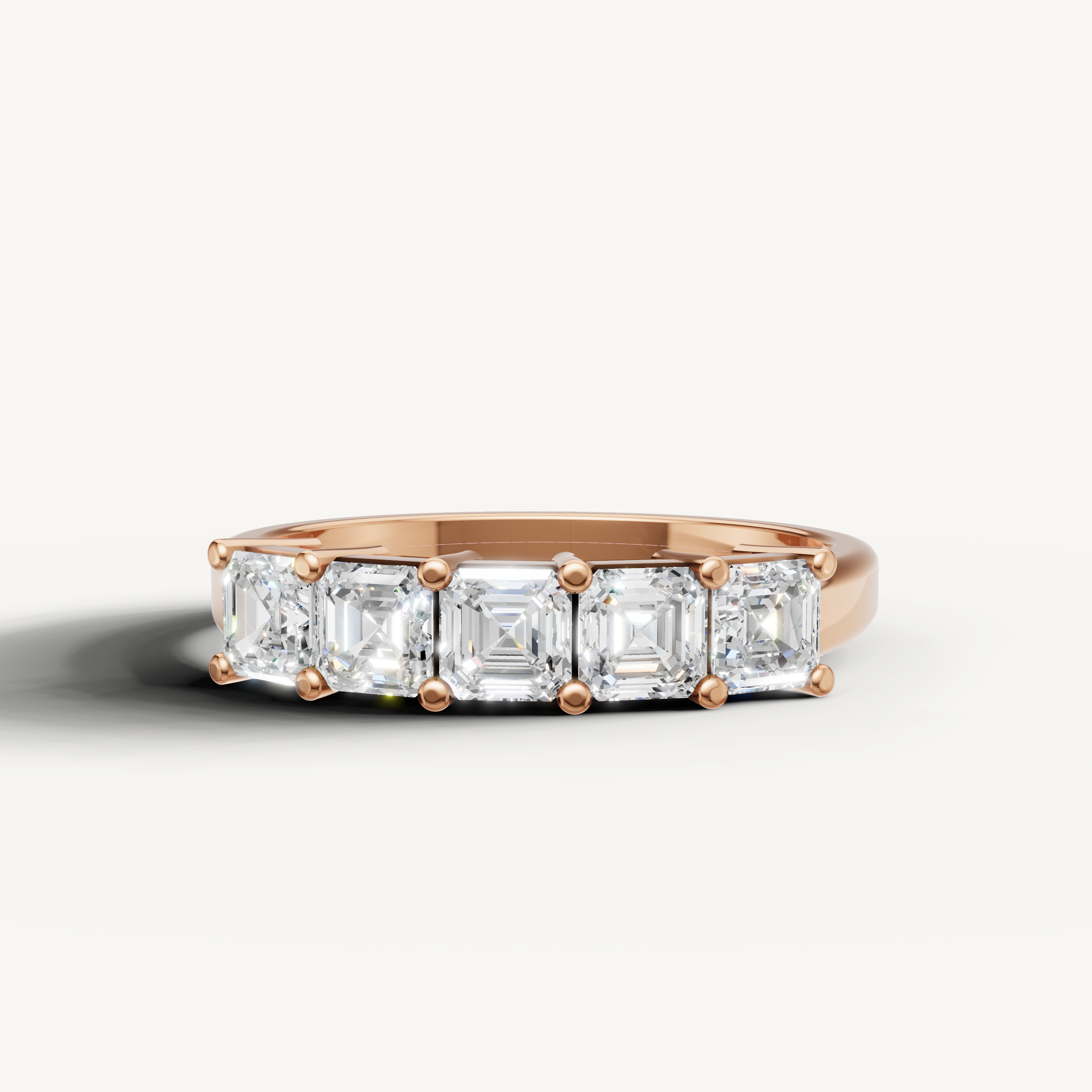 Raul Diamonds rose gold wedding band with Asscher cut lab grown diamonds in an elegant five stone style